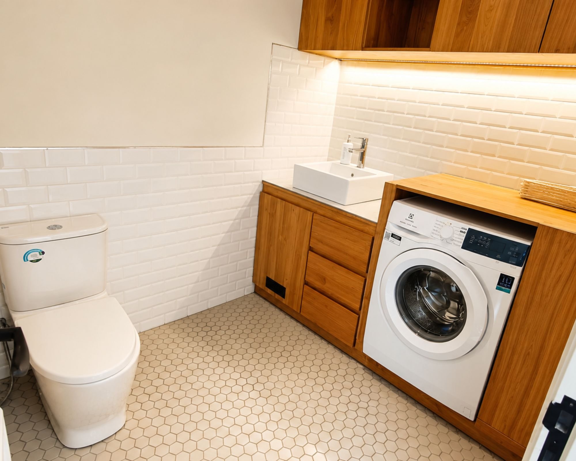 Downstair restroom along with top of the line washing machine 