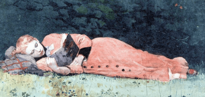 A woman with red hair and glasses lying on her side on grass, reading a book, with a dark starry sky above.