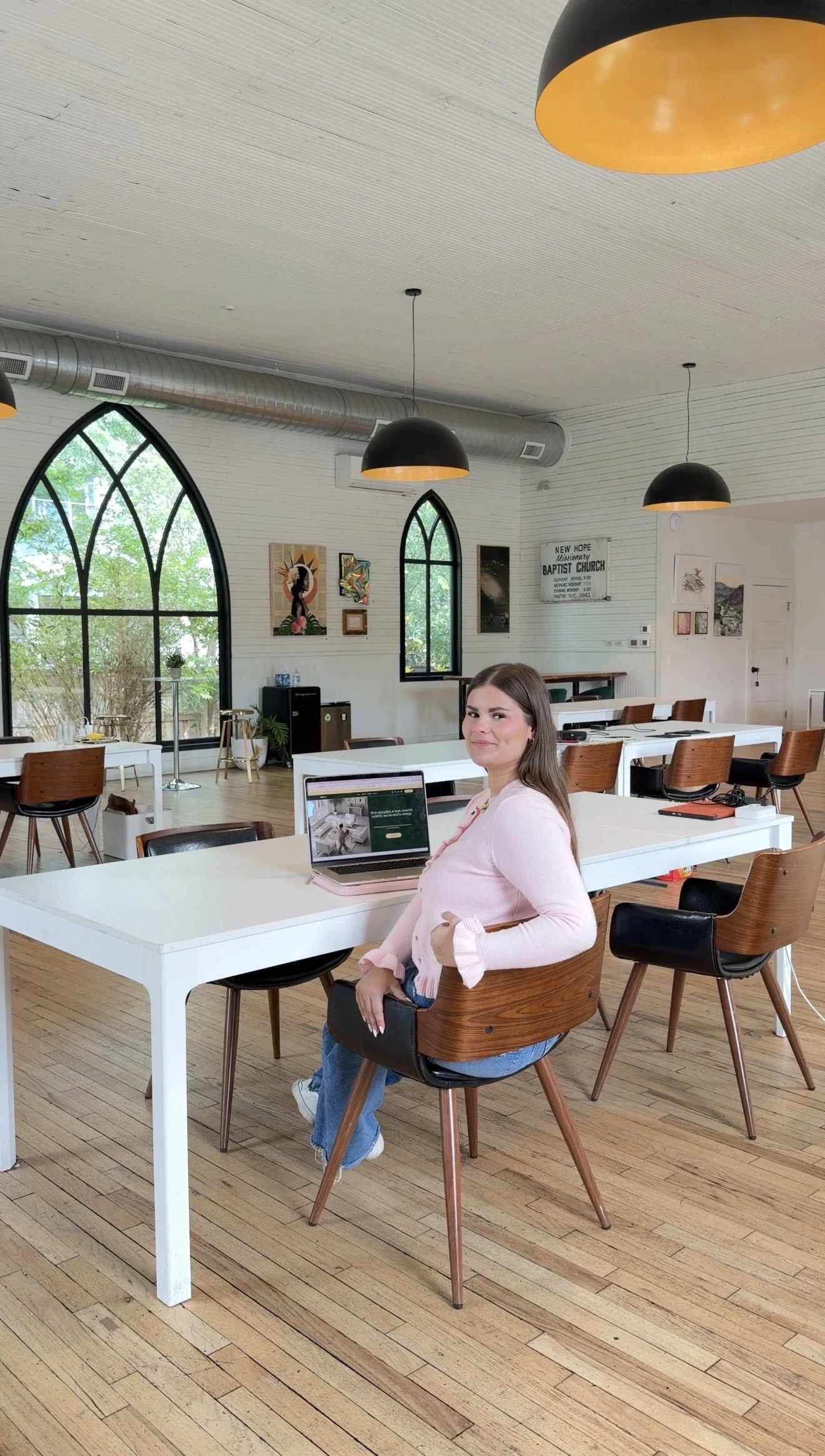 employee smiling while working at a desk in the office