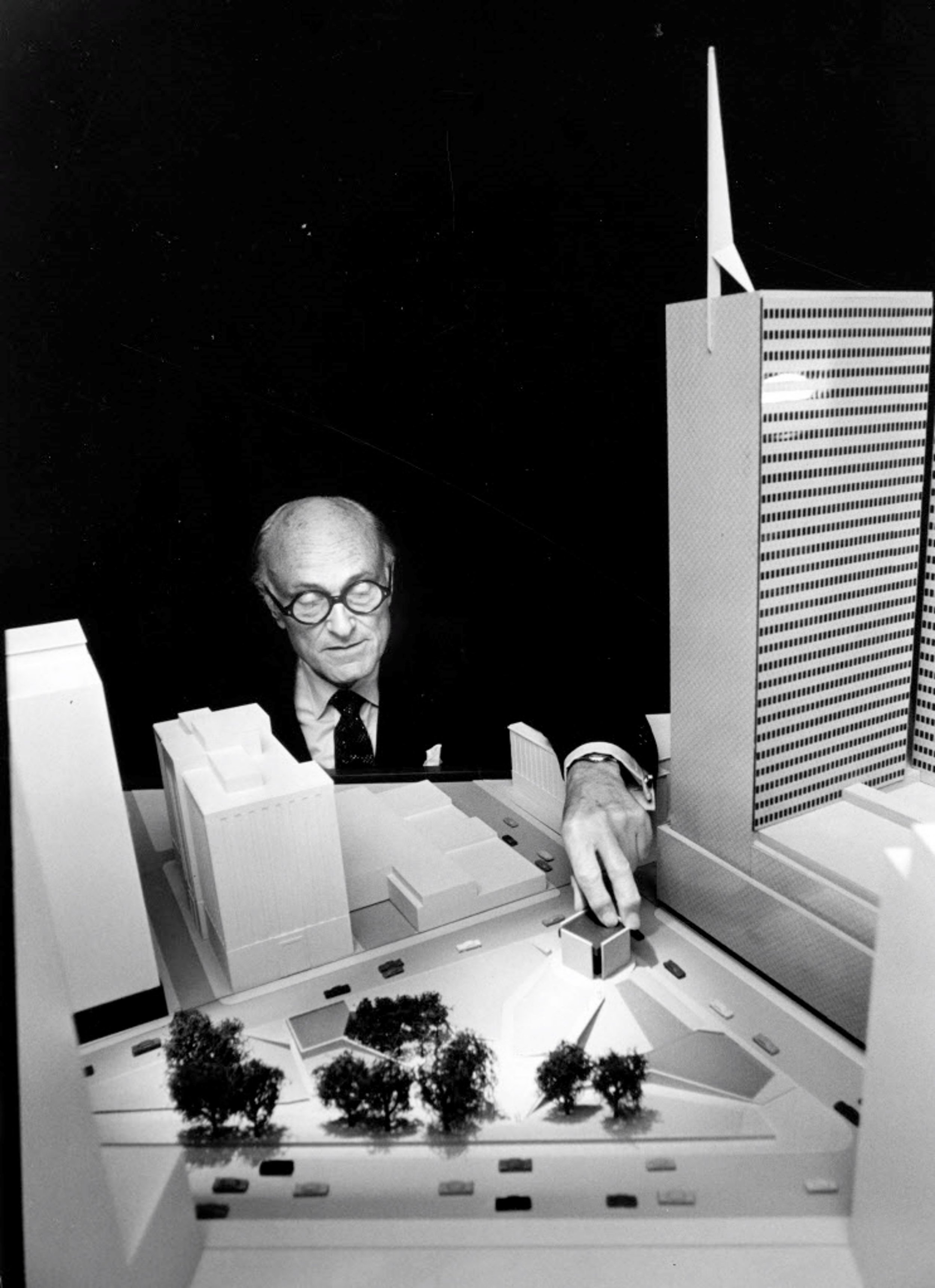  Architect Philip Johnson, later the first recipient of the Pritzker Prize, reviews a model of his visionary design for Thanks-Giving Square after being selected for the project in 1971. 