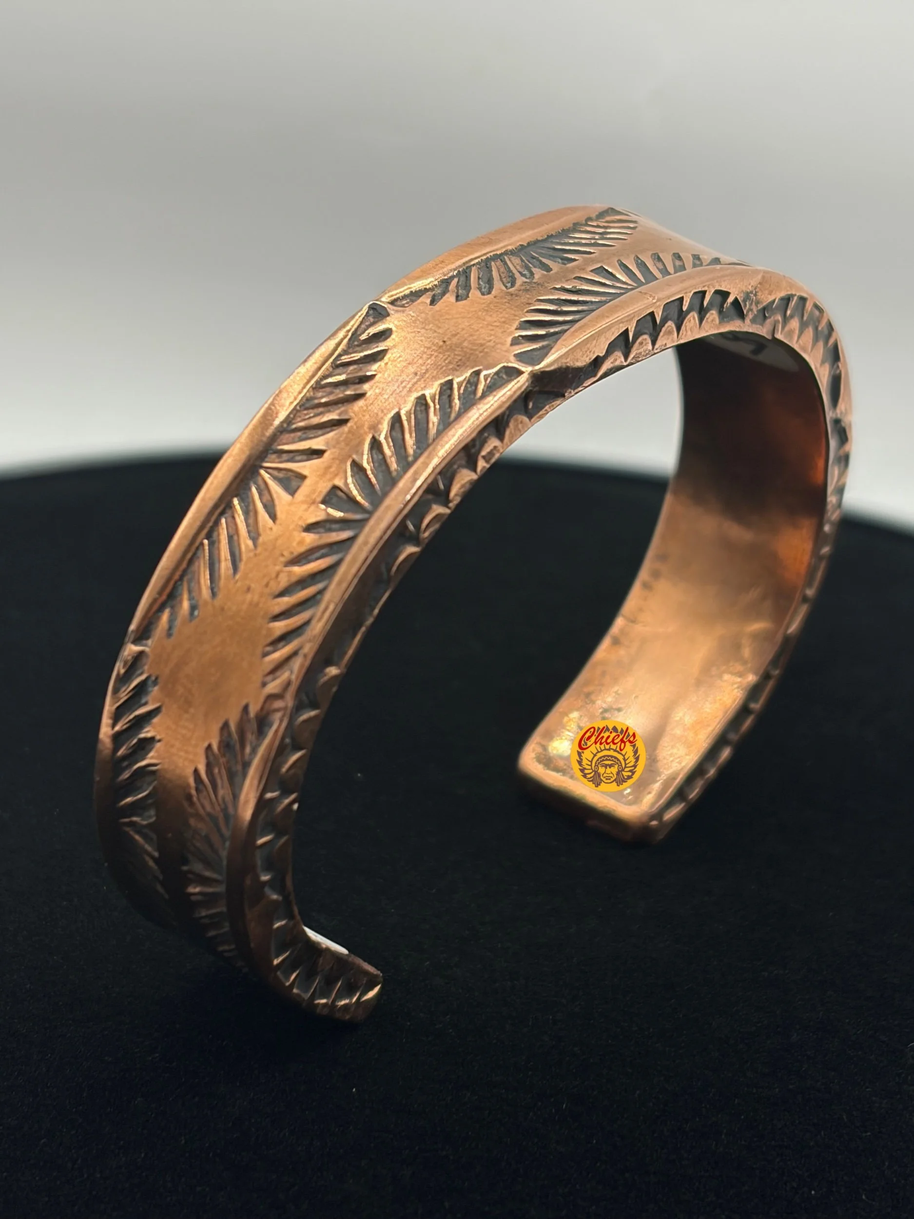 Copper Bloom Cuff

This hand-stamped copper cuff features a bold, western inspired pattern that gives it a rugged yet refined look. Crafted with a warm copper finish, the etched detailing adds texture and character while keeping the design timeless a