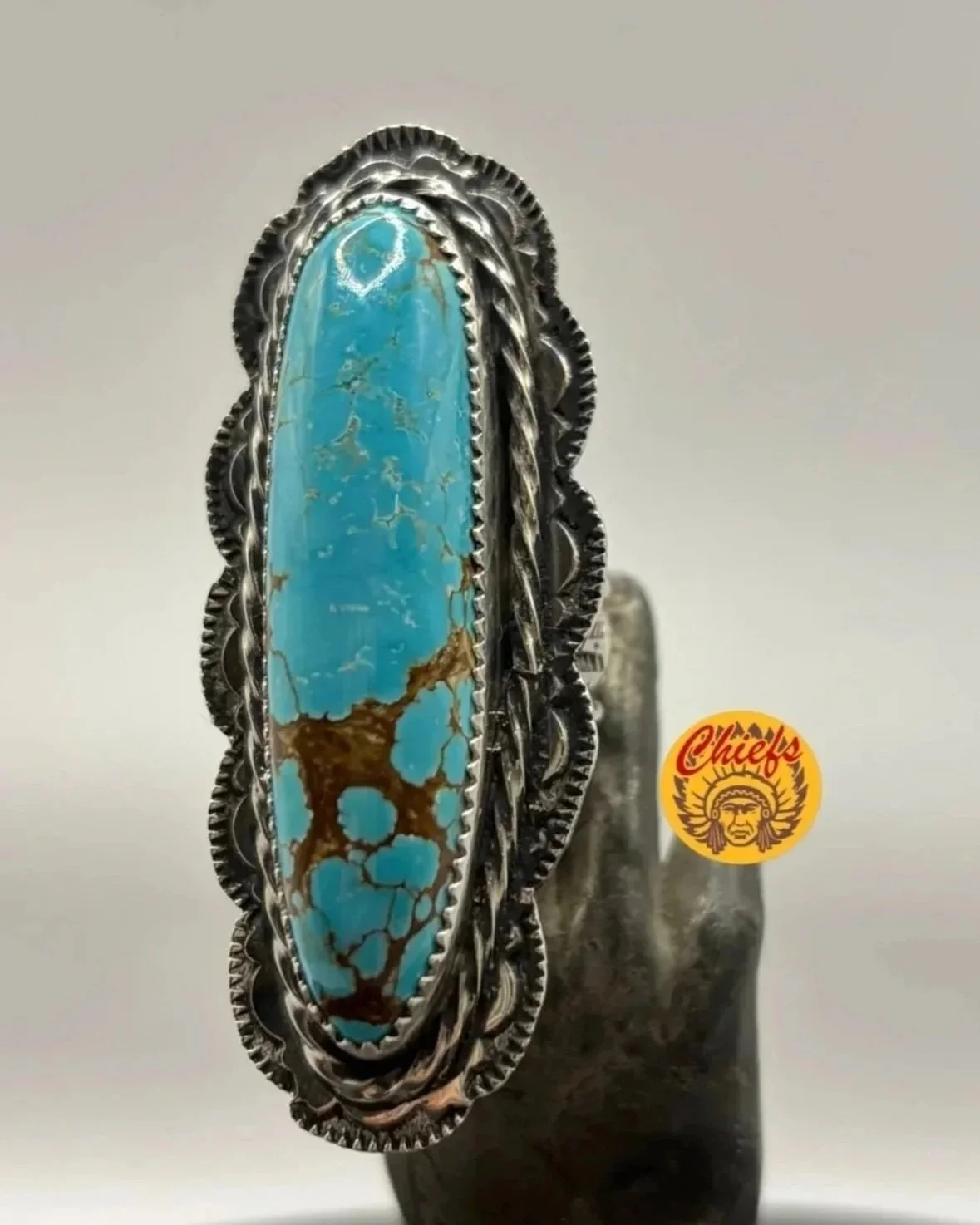 Number 8 Turquoise Ring

Handcrafted in sterling silver and designed to stand out. Featuring a long, vibrant blue turquoise stone with beautiful natural brown matrix, this piece showcases the unmistakable character and high-grade beauty that Number 8