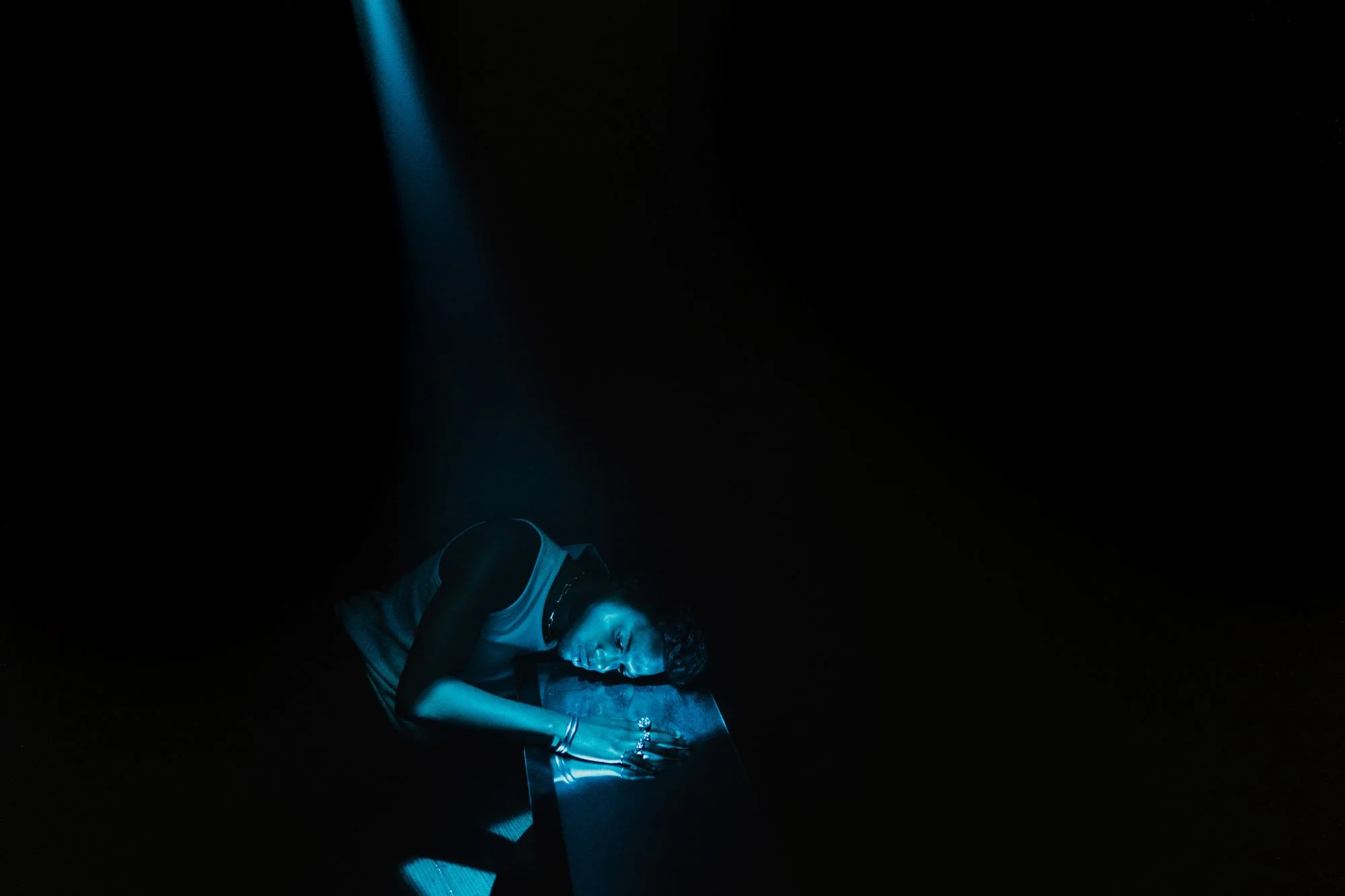 Hamburg-based portrait studio photoshoot focusing on vulnerability and societal pressure through cinematic photography.