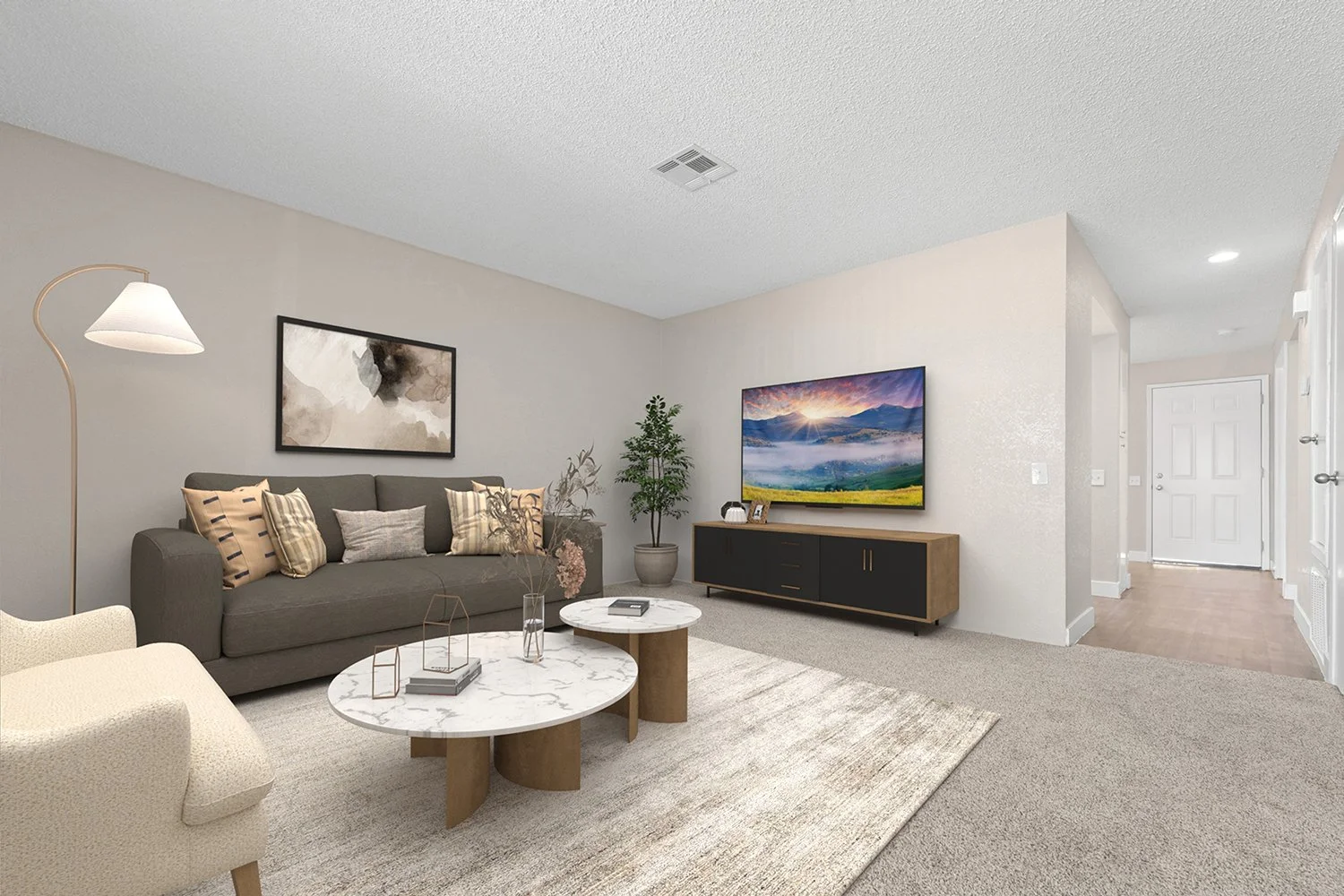 Spacious living area in Andorra 2 bedroom apartment home with plush carpeted flooring and sliding doors leading to private patio. 