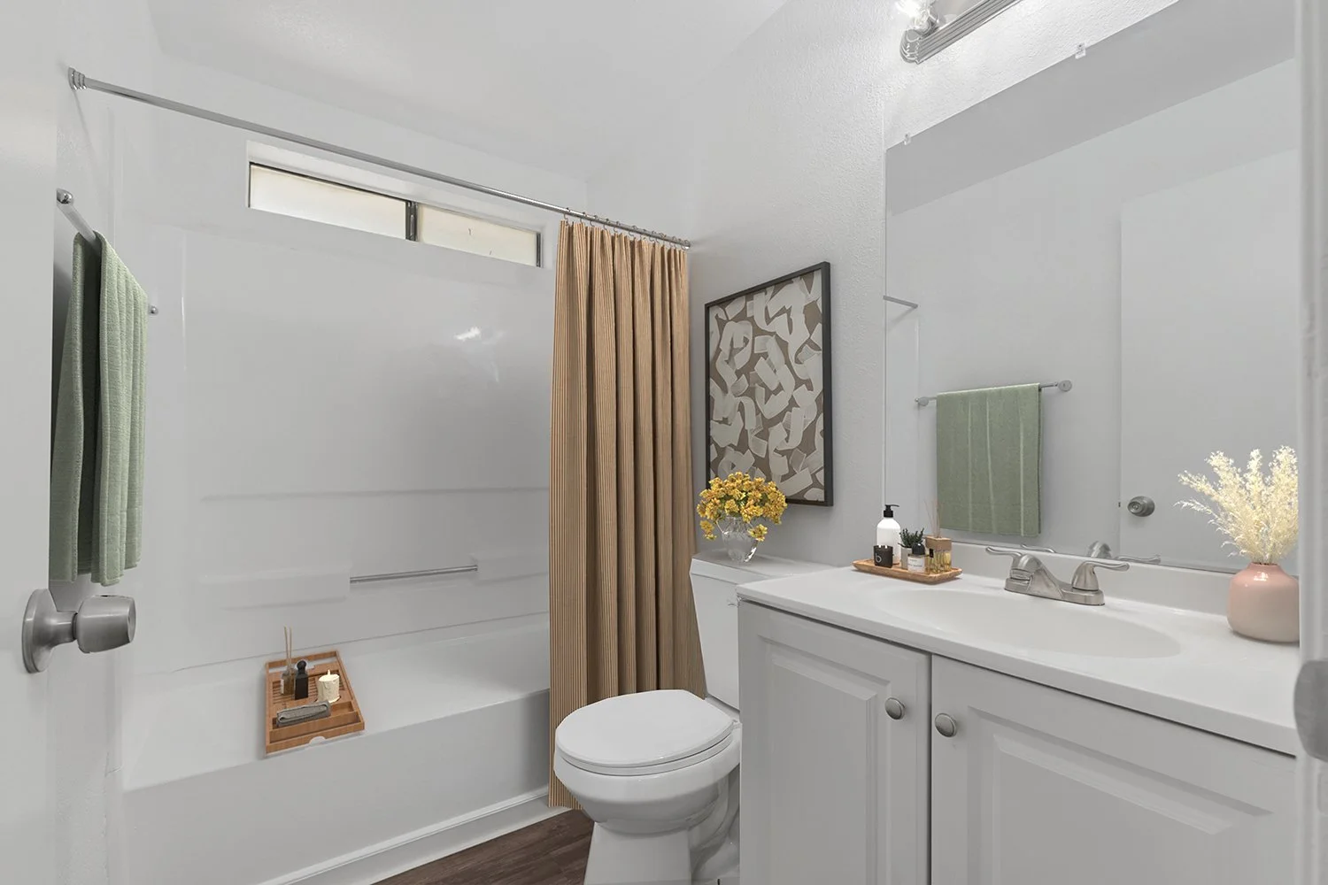 Bathroom in Andorra 2 Bedroom apartment home with wood-style plank flooring, large shower/tub and a single sink vanity with large mirror and plenty of cabinet space. 