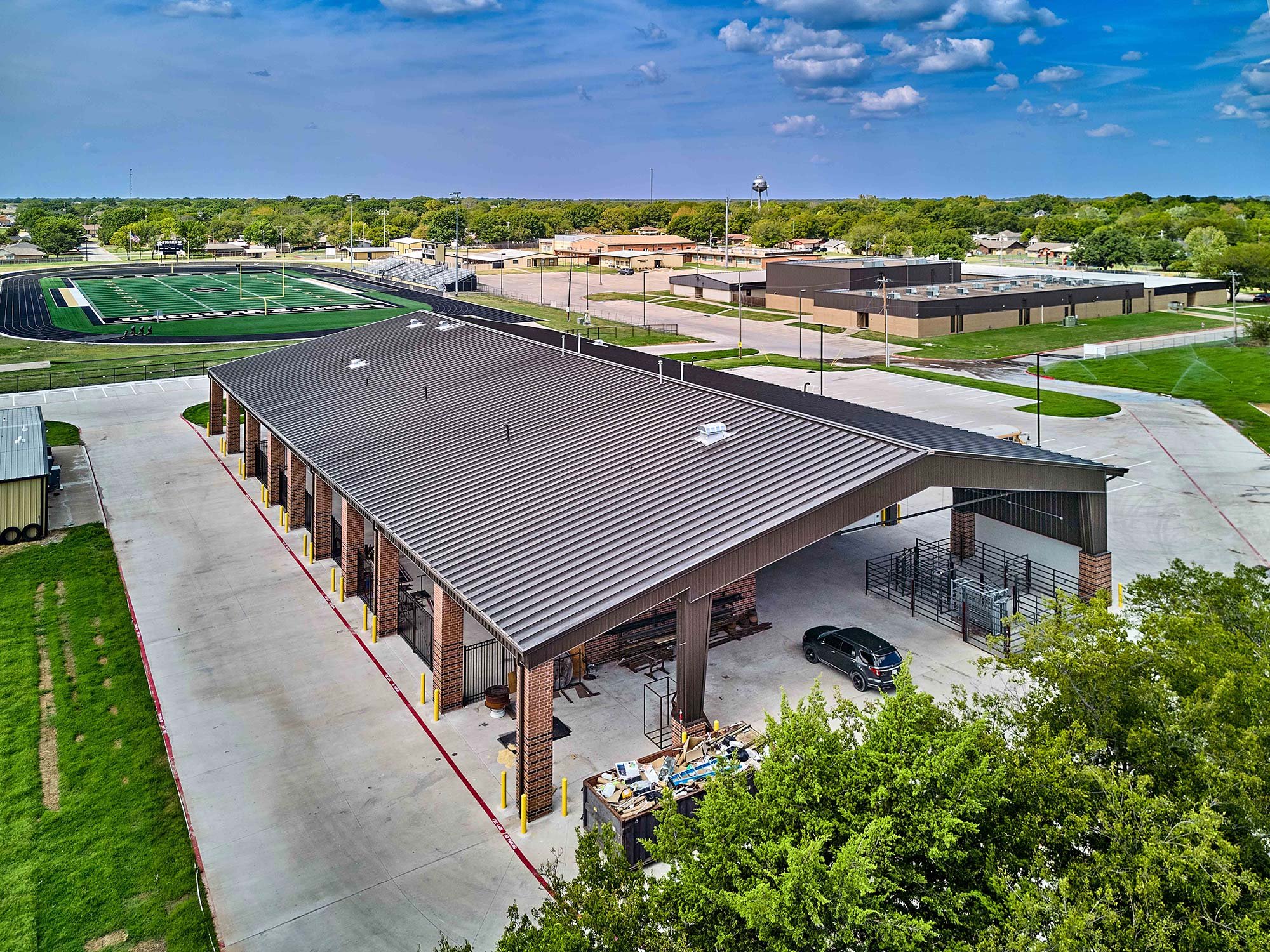 WRA Architects: Whitewright ISD Career and Technical Education Center Exterior with Football Field in the Background