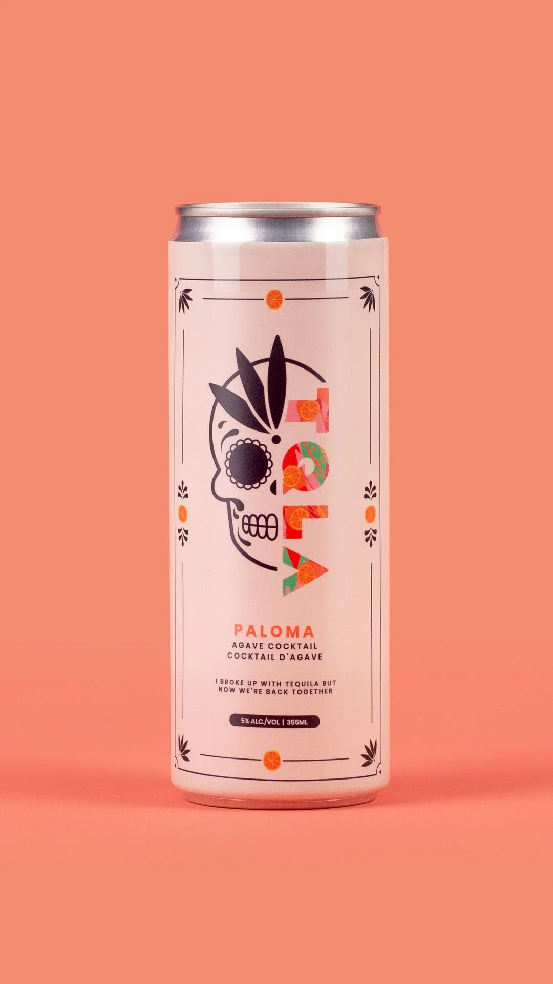 A can of Paloma agave cocktail with a design featuring a stylized skull and colorful botanical elements on a peach background.