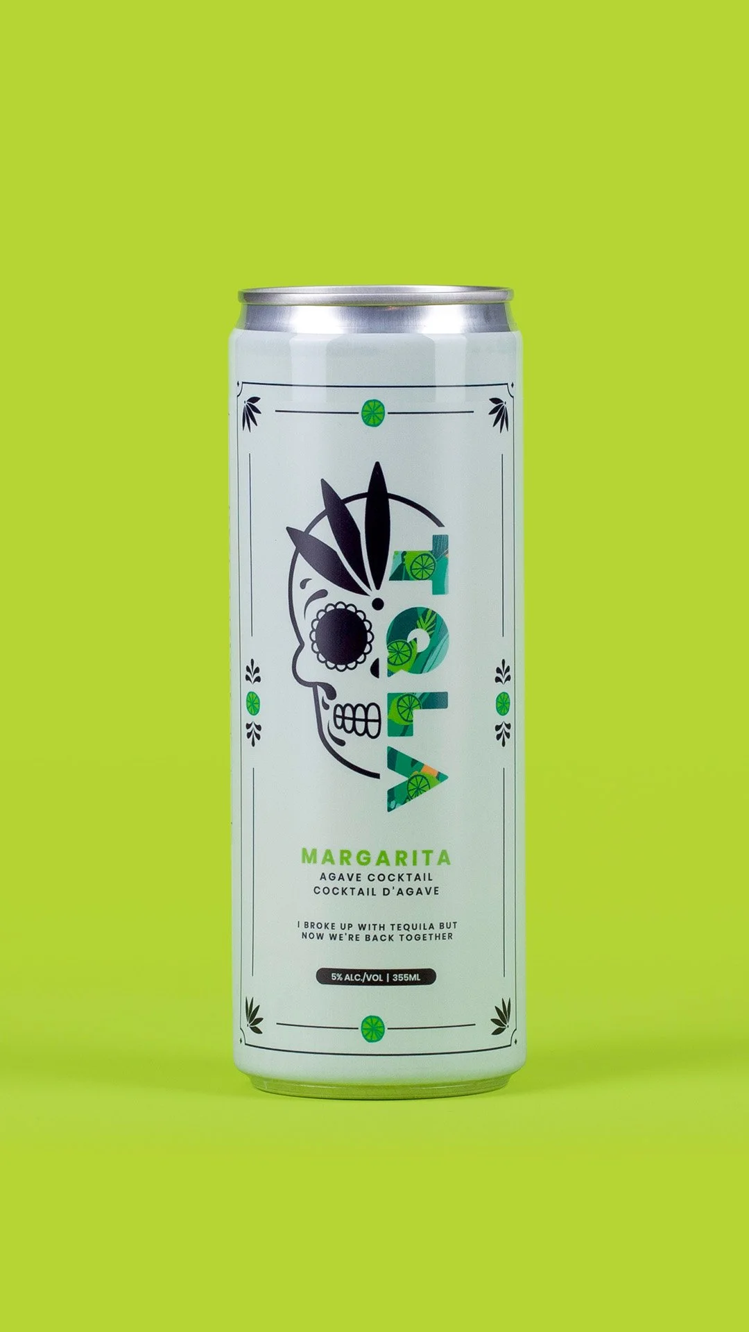 A can of Margarita agave cocktail with a label featuring a stylized skull face made of a black outline, green lime slices, and abstract shapes, set against a bright green background.