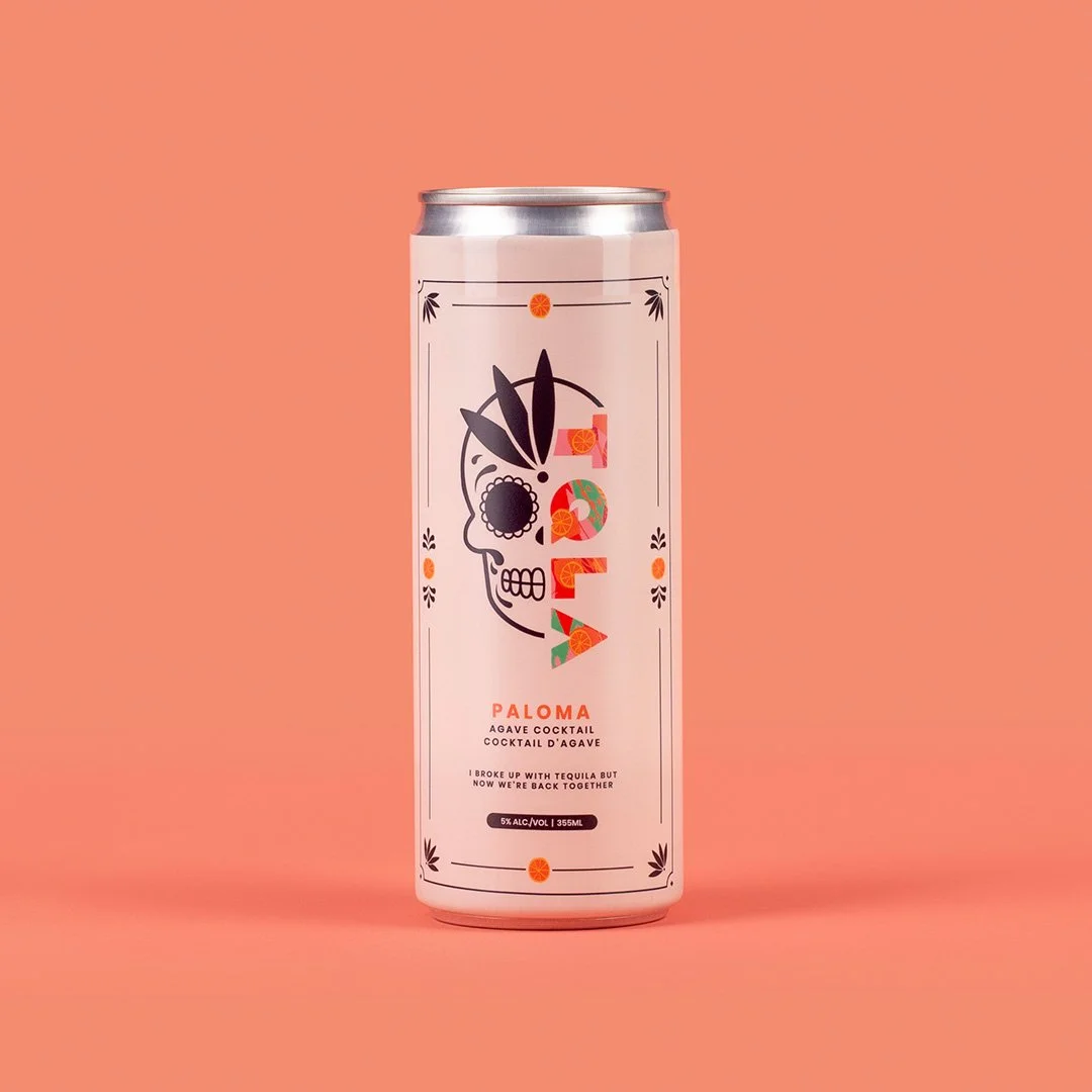 A tall, slim can of Paloma agave cocktail featuring a colorful skull with floral details on a pink background.