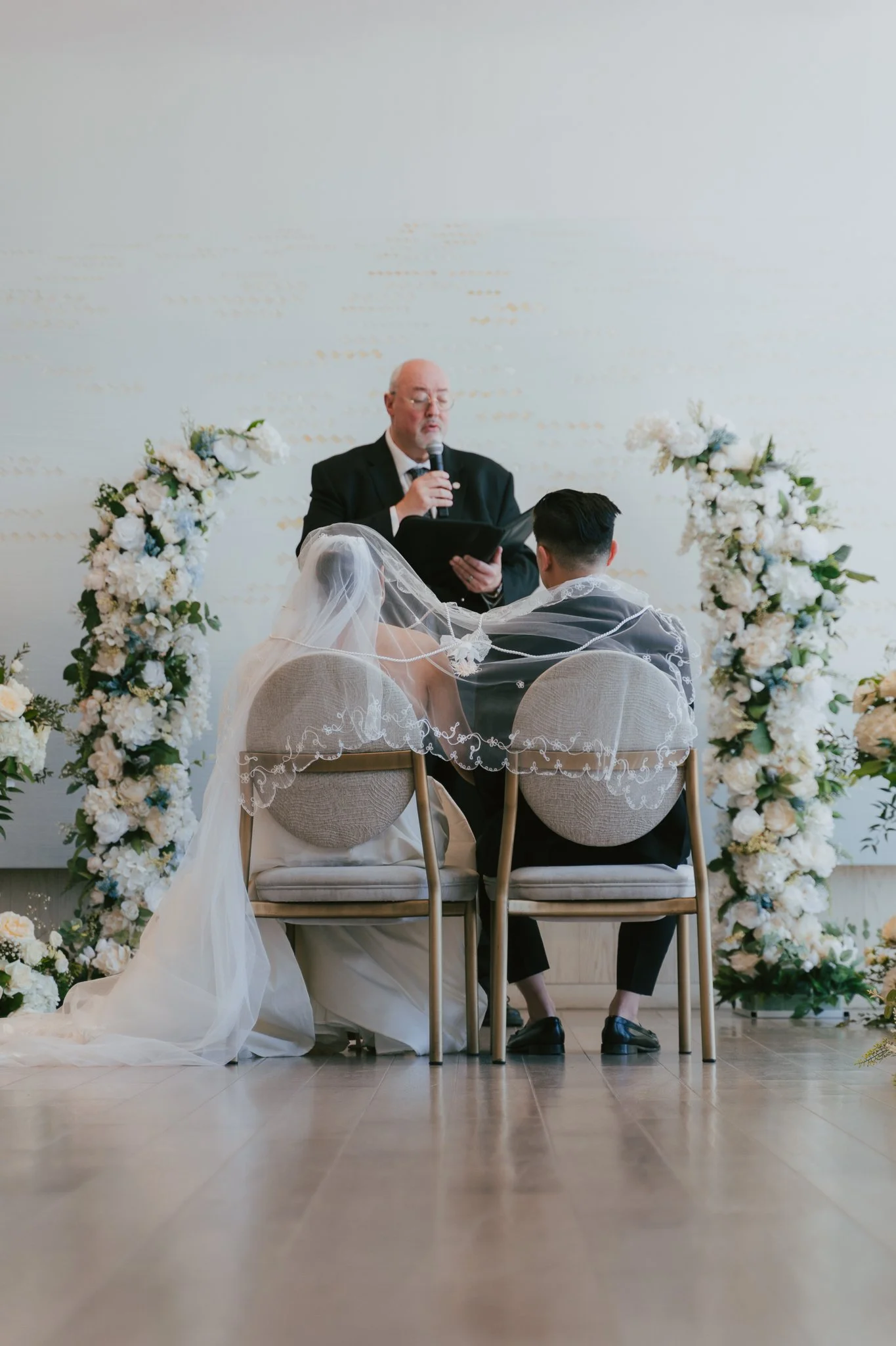 A bride and groom being married at their Pearle Hotel and Spa wedding