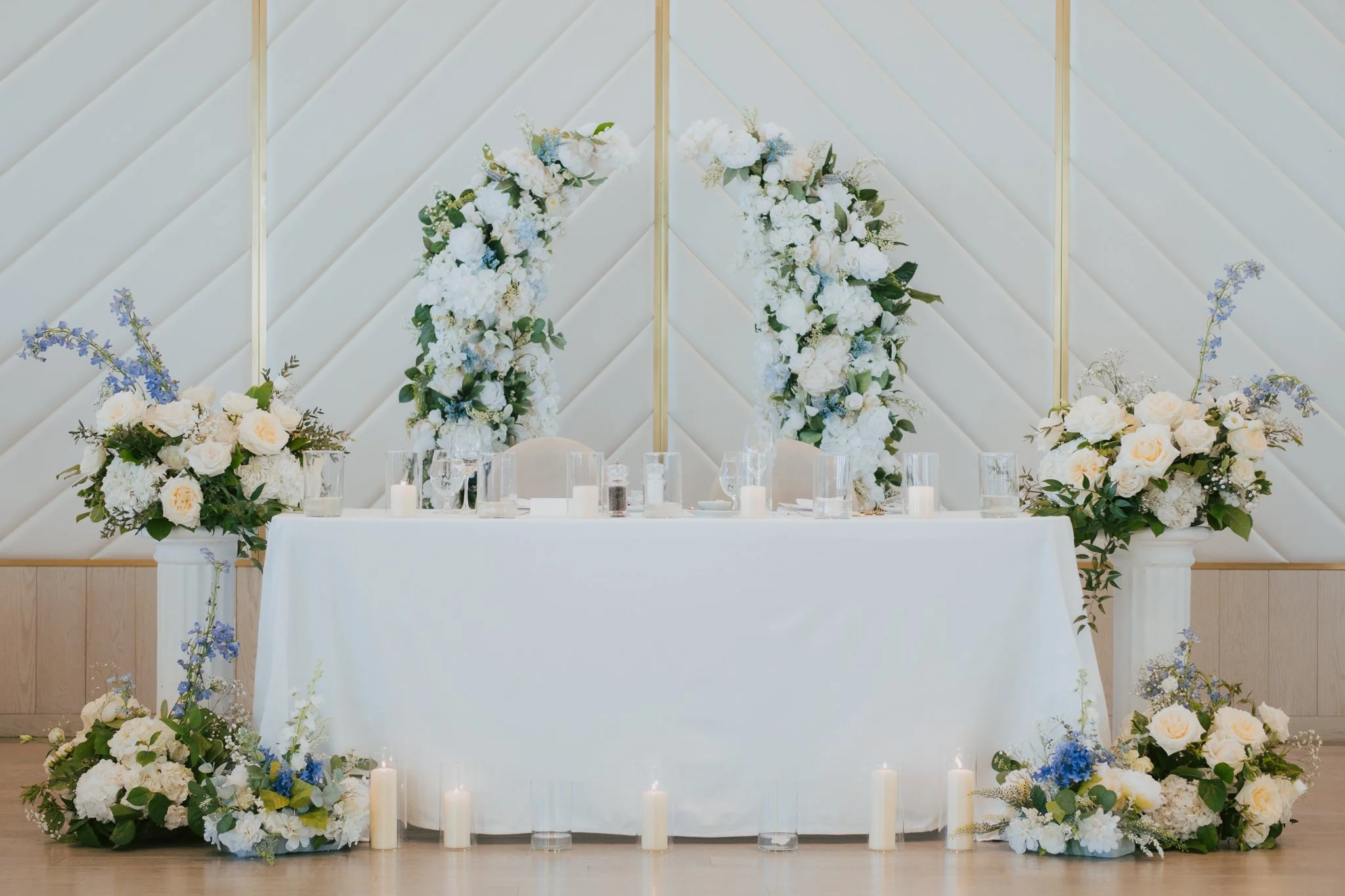 A head table floral display at the pearle hotel and spa