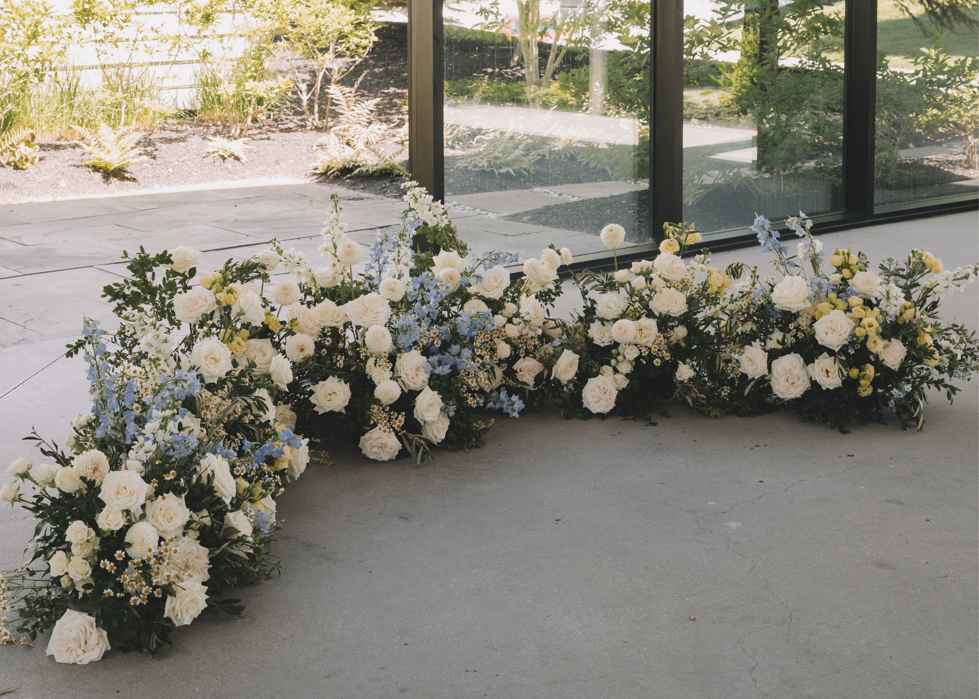 A lush floral meadow in the ceremony space at whistle bear golf club.