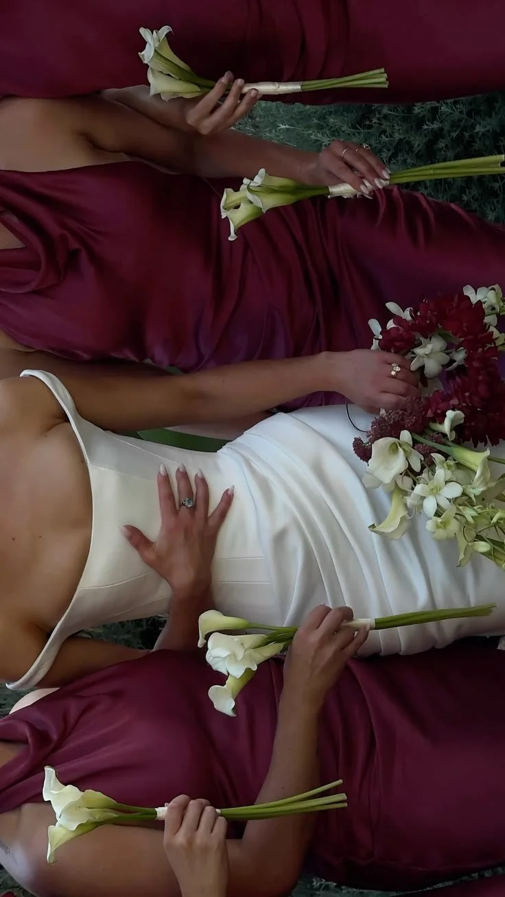 Bride and bridesmaids in burgundy wedding dresses with calla lily bouquet. Hamilton wedding Flowers