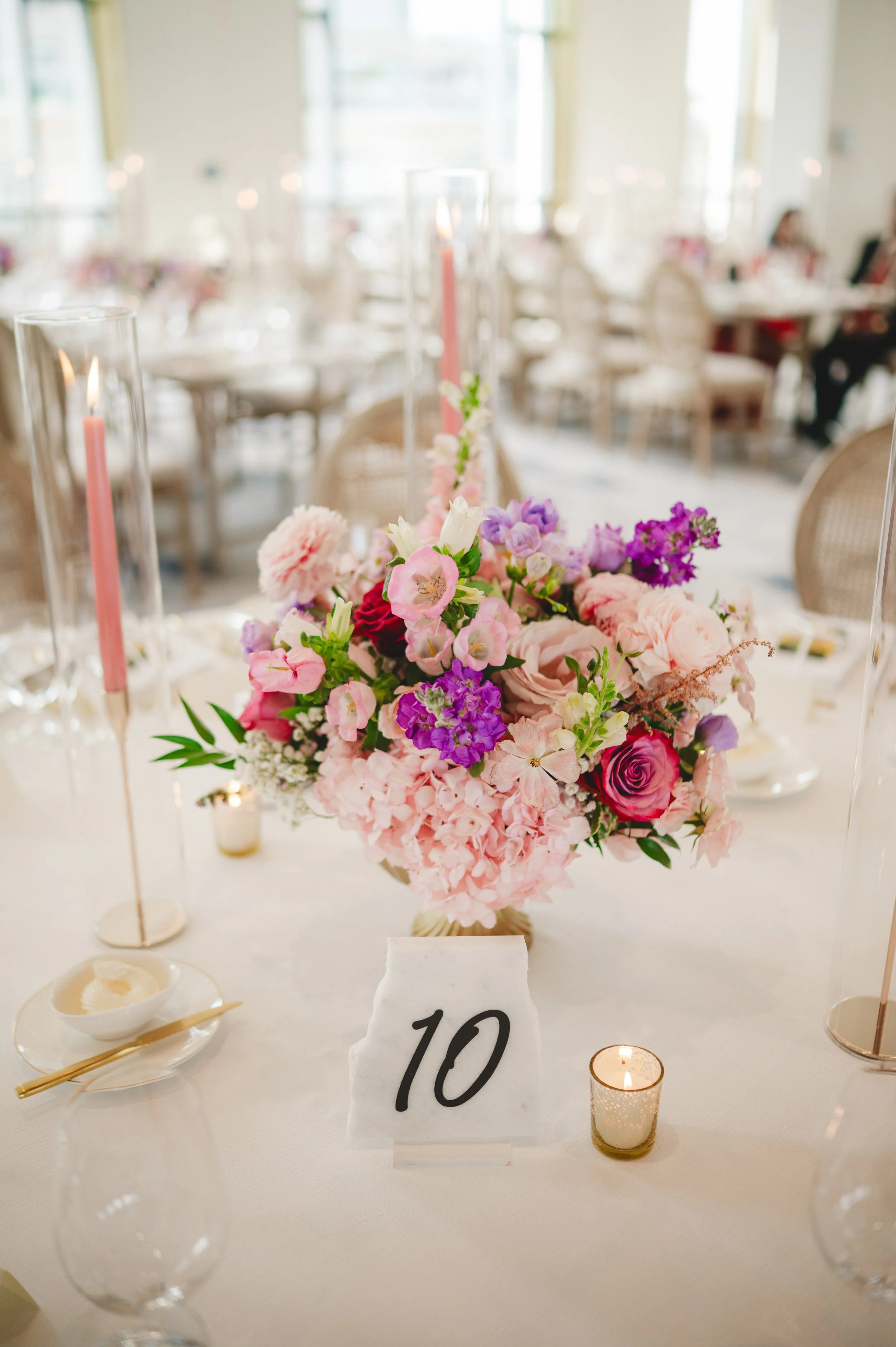 Pink and Purple Floral Centrepiece at a wedding at the Pearle Hotel and Spa