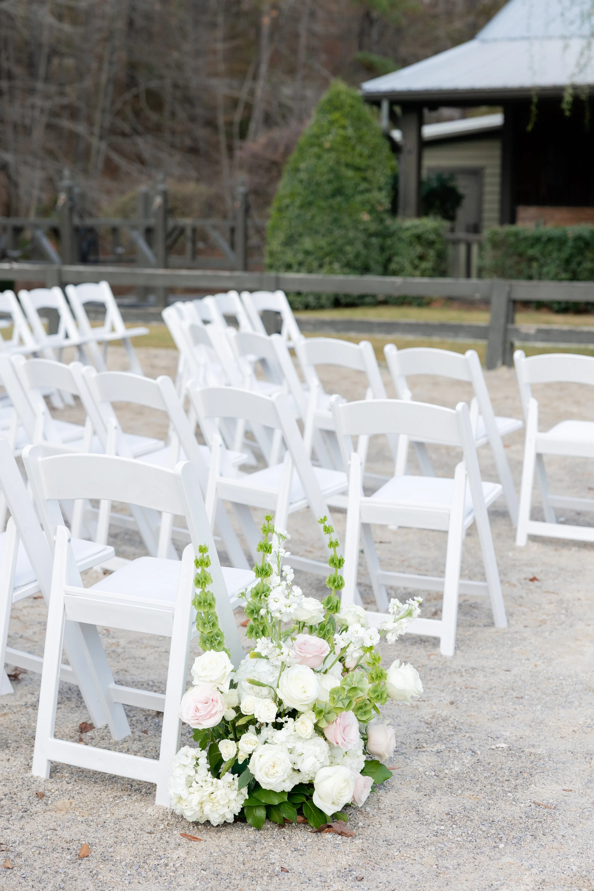 A_Windwood_Wedding_Outdoor_Ceremony_Seating_Design_FLorals_Aisle.jpg