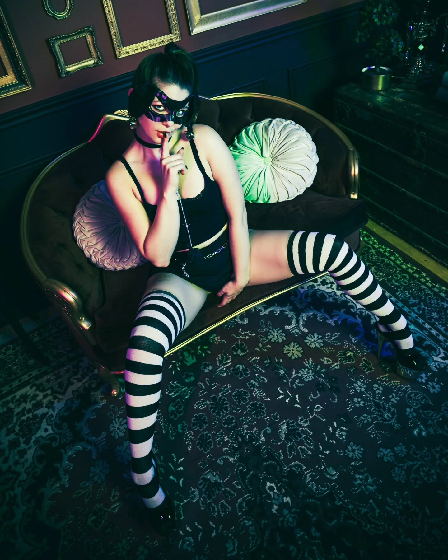 Stealing hearts in stripes and shadows. Don&rsquo;t tell.
.
.
#DarkSeduction #MoodyPortraits #GothGlam #TorontoPhotographer #AltModel #GTAphotography #NeonNoir #ShadowPlay #VelvetVibes #TemptationInBloom