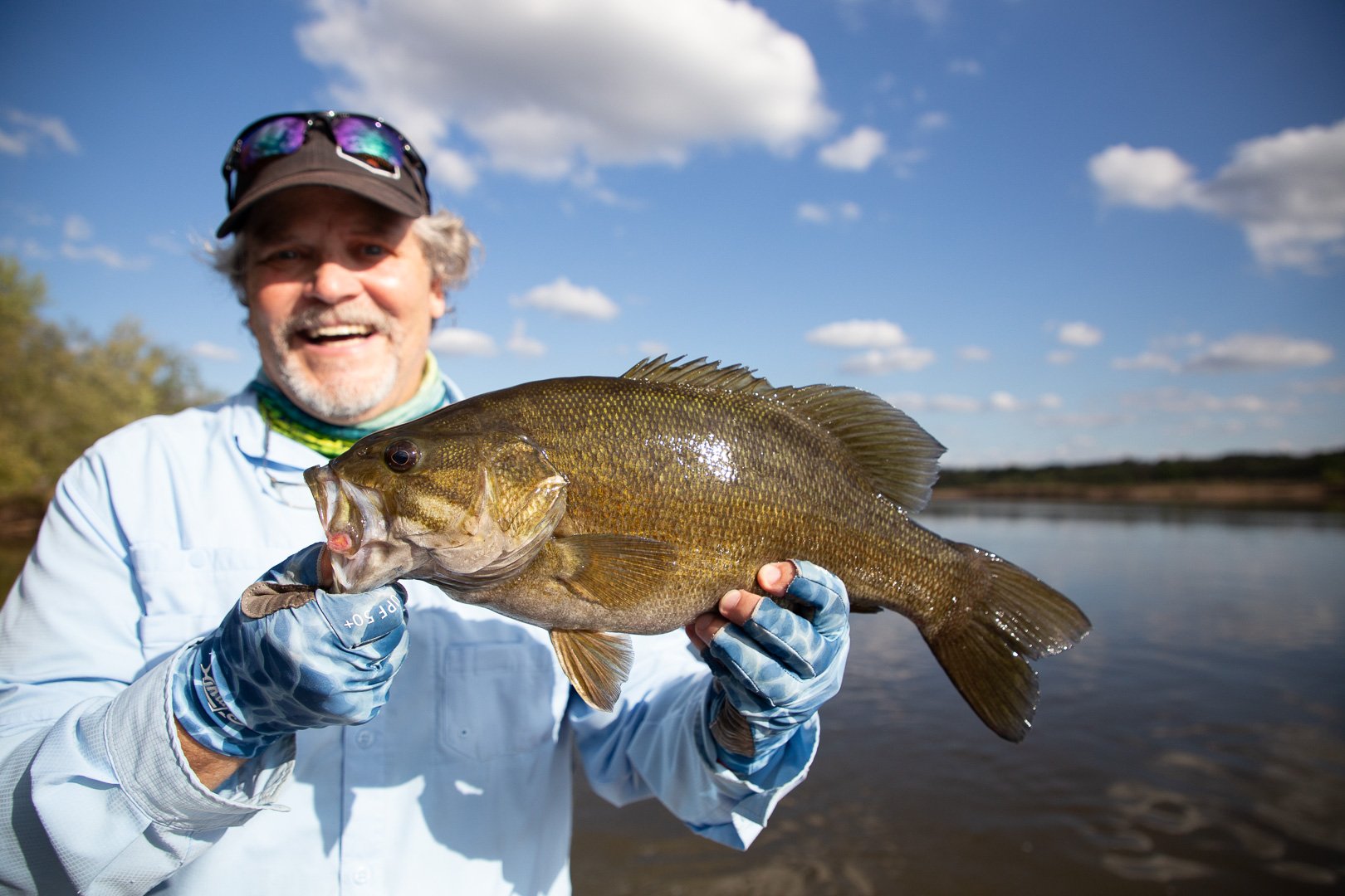 September caught Wisconsin smallmouth bass being held by an angler