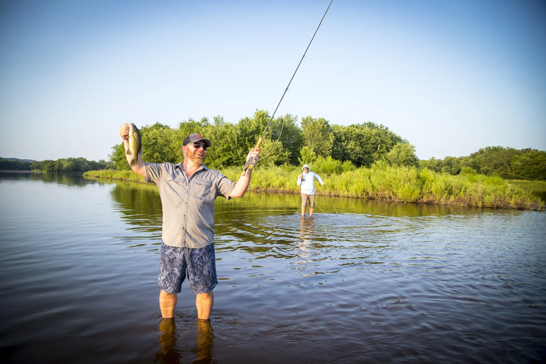 angler smallmouth bass fly fishing on the Wisconsin River