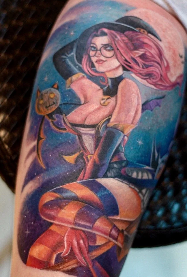 Colorful fantasy witch tattoo with pink hair, glasses, a pointed hat, and striped stockings, by Colina.