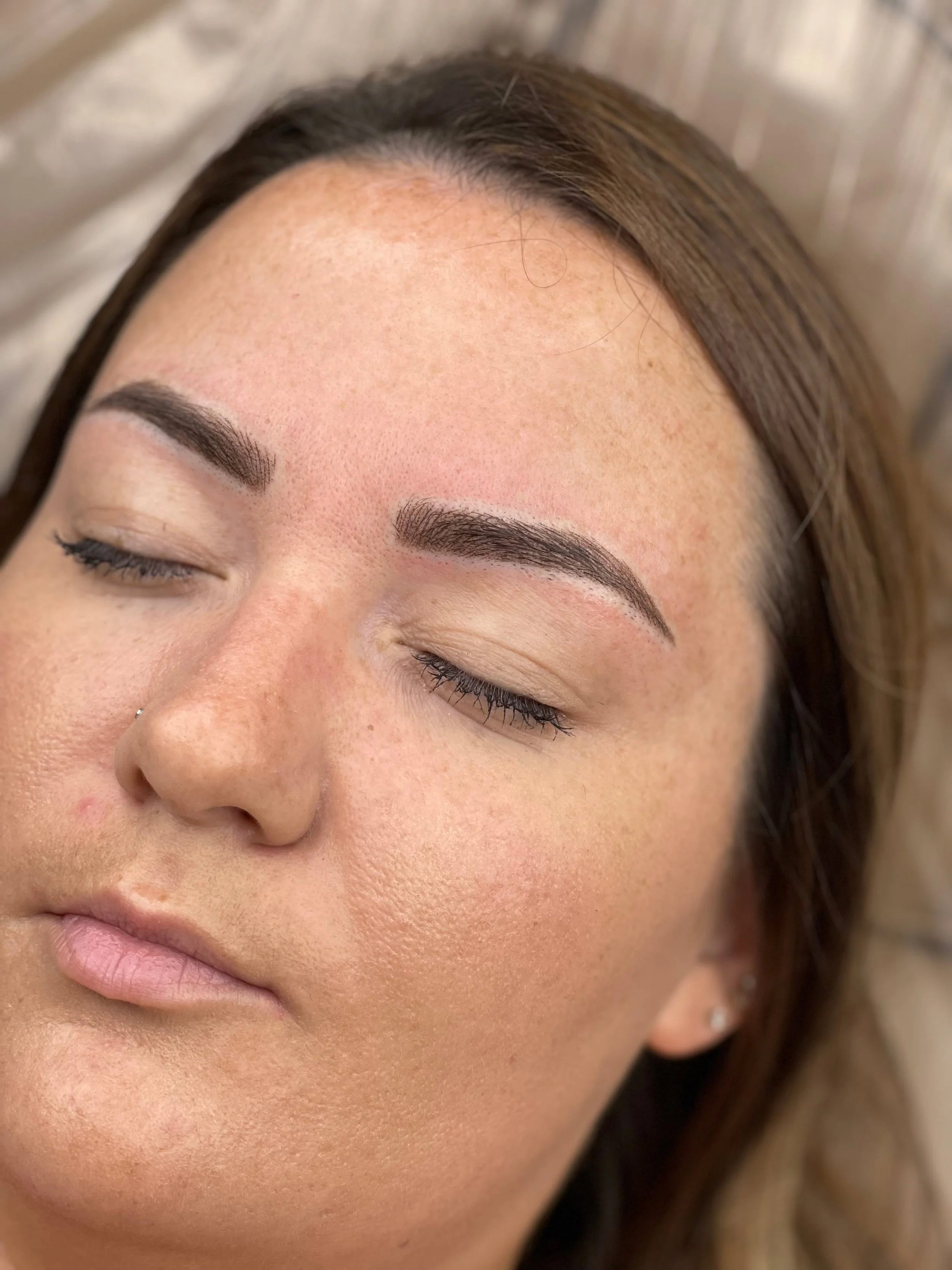 Client with finished bold powder brows.