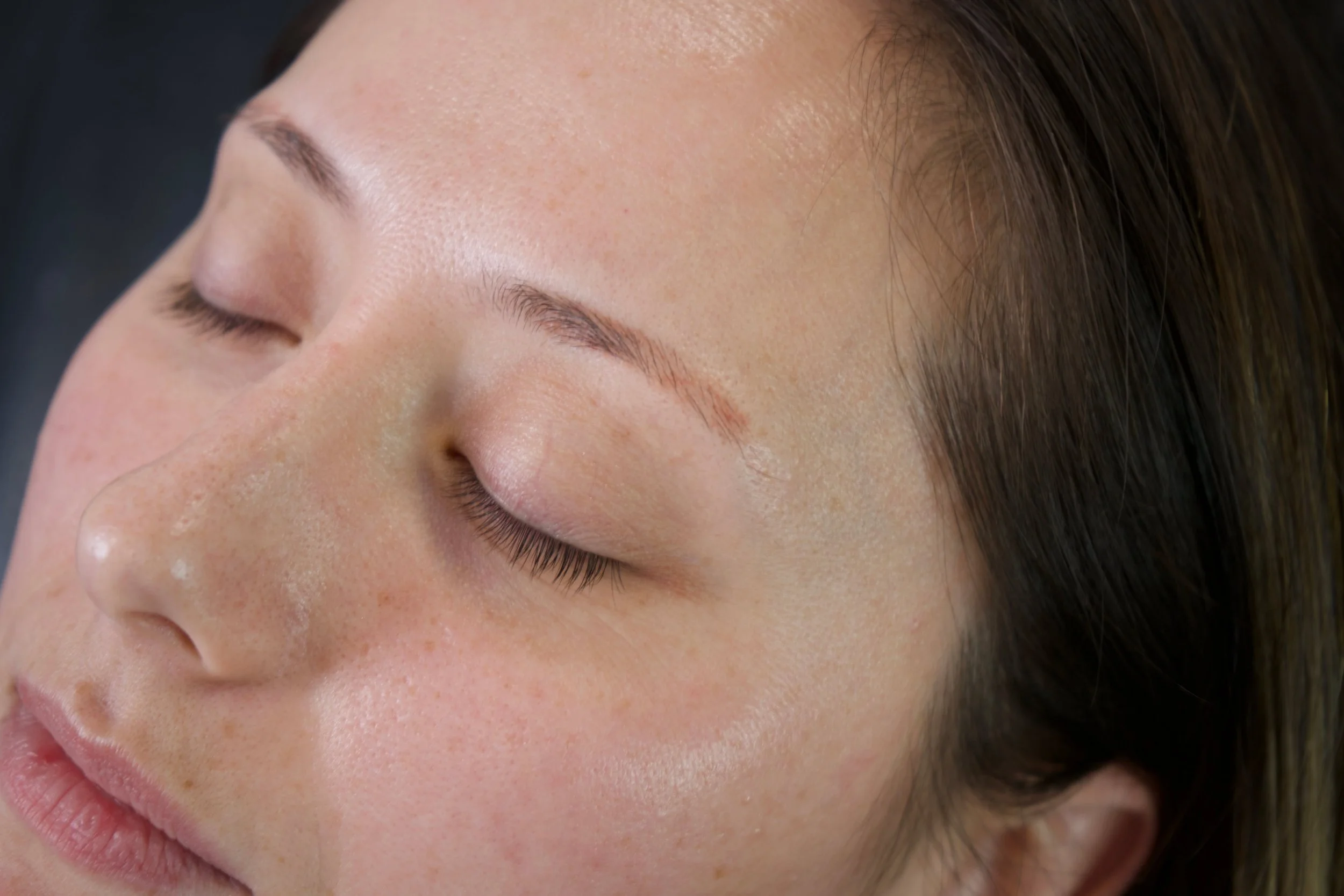 Client with light natural brows before permanent makeup enhancement.