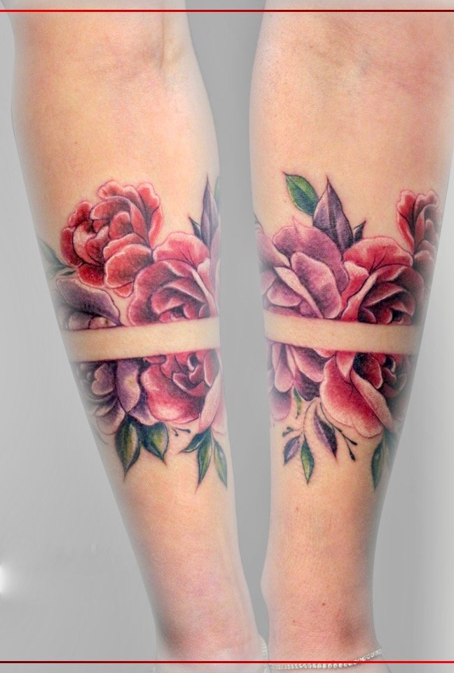 Two views of a red-and-pink floral forearm tattoo with green leaves and a clear horizontal band, by Colina.