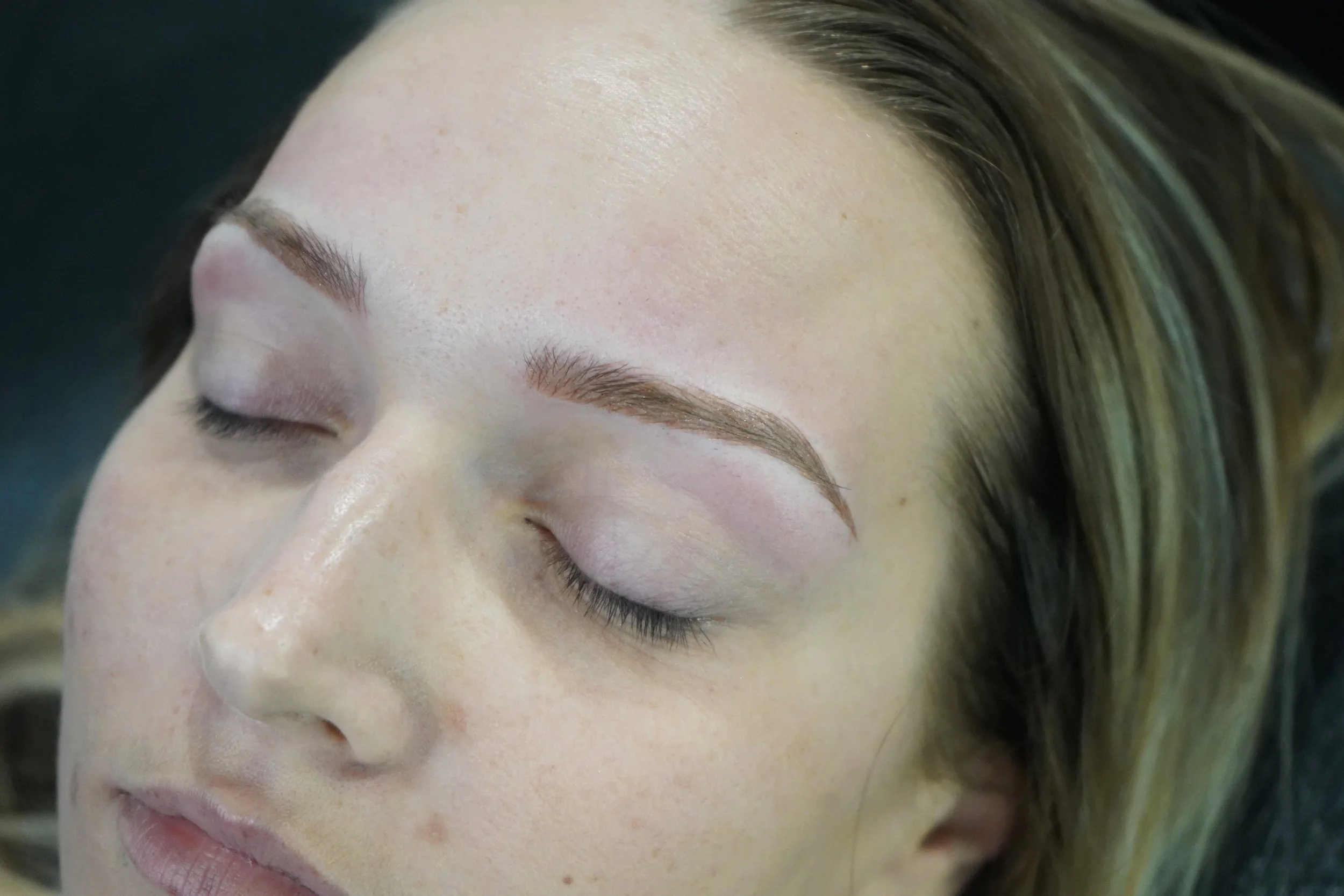 Client’s brows prepared for a permanent makeup service.
