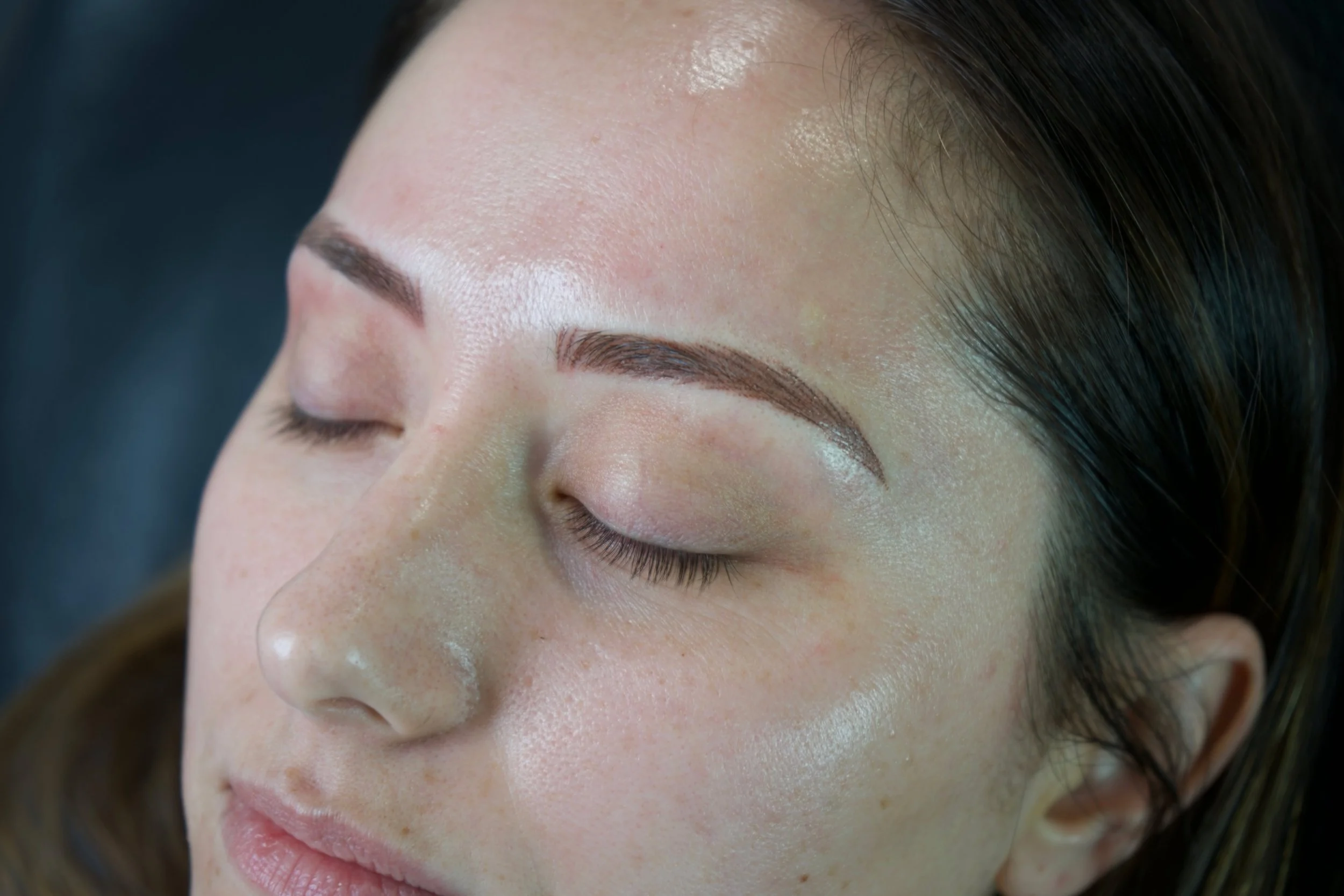 Client with completed soft-shaded powder brows.