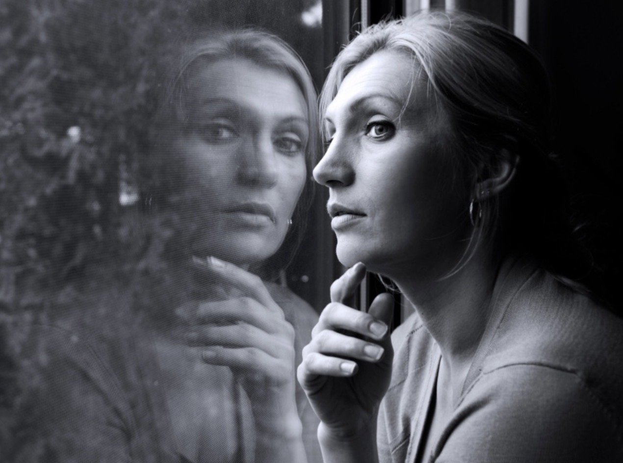 Woman reflecting on emotional healing and repeating life patterns
