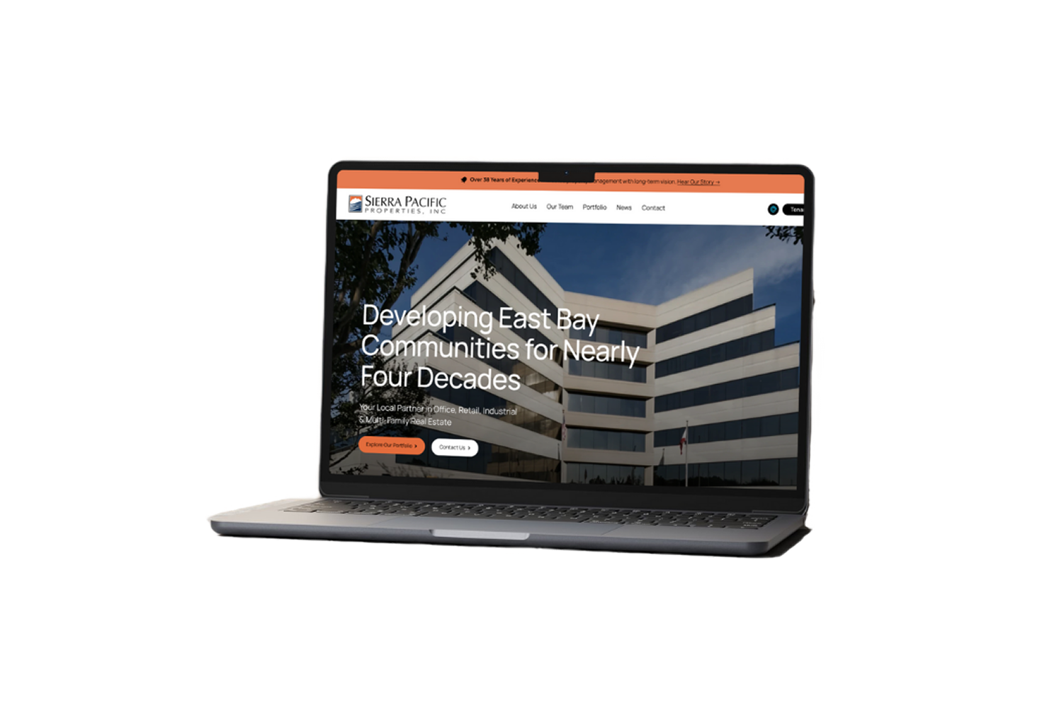 Laptop displaying a website for Sierra Pacific Properties, Inc., showing a modern building and text about developing East Bay communities for nearly four decades.