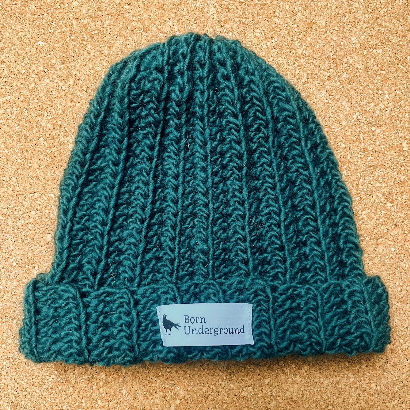 teal_hat_label_warm.jpg