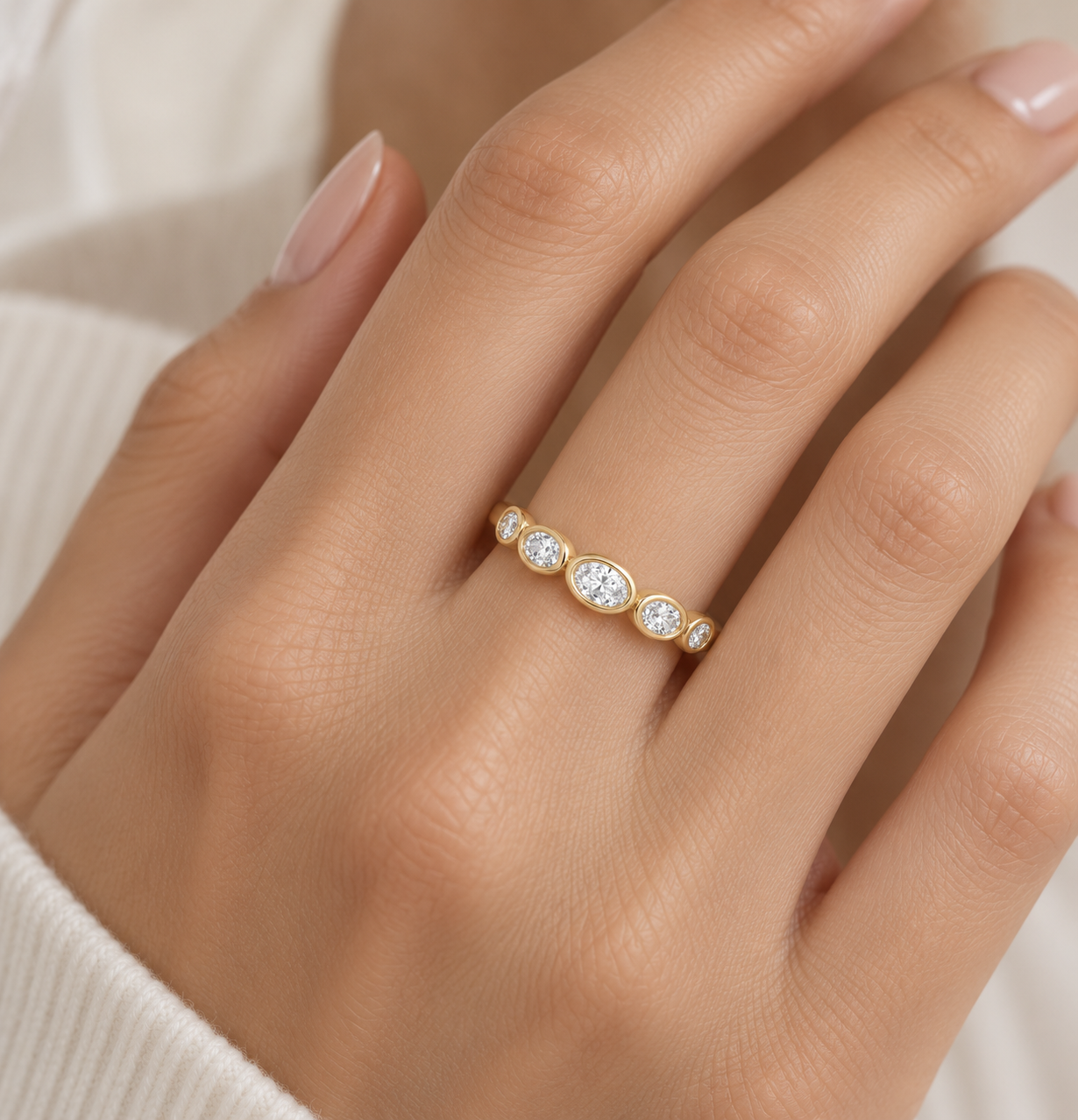 Lab grown five stone bezel set oval diamond band from Brilliant Fine+Custom gifted as a meaningful push present ring