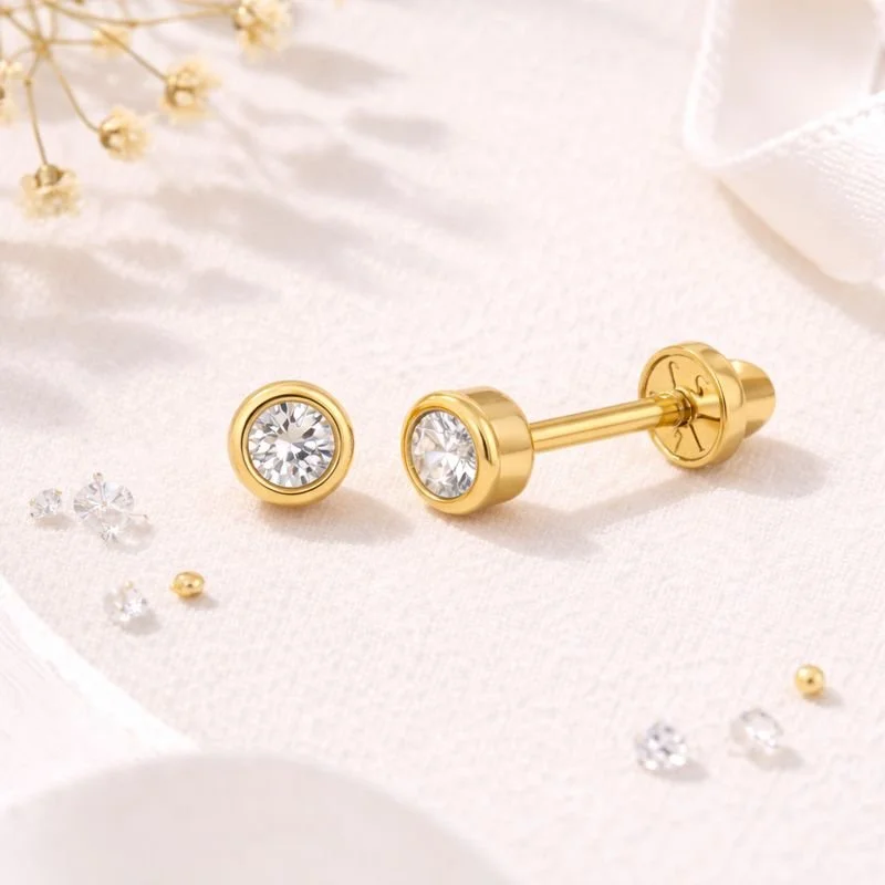 14k yellow gold bezel-set diamond stud earrings with threaded posts and safety screw backs, shown as a pair.