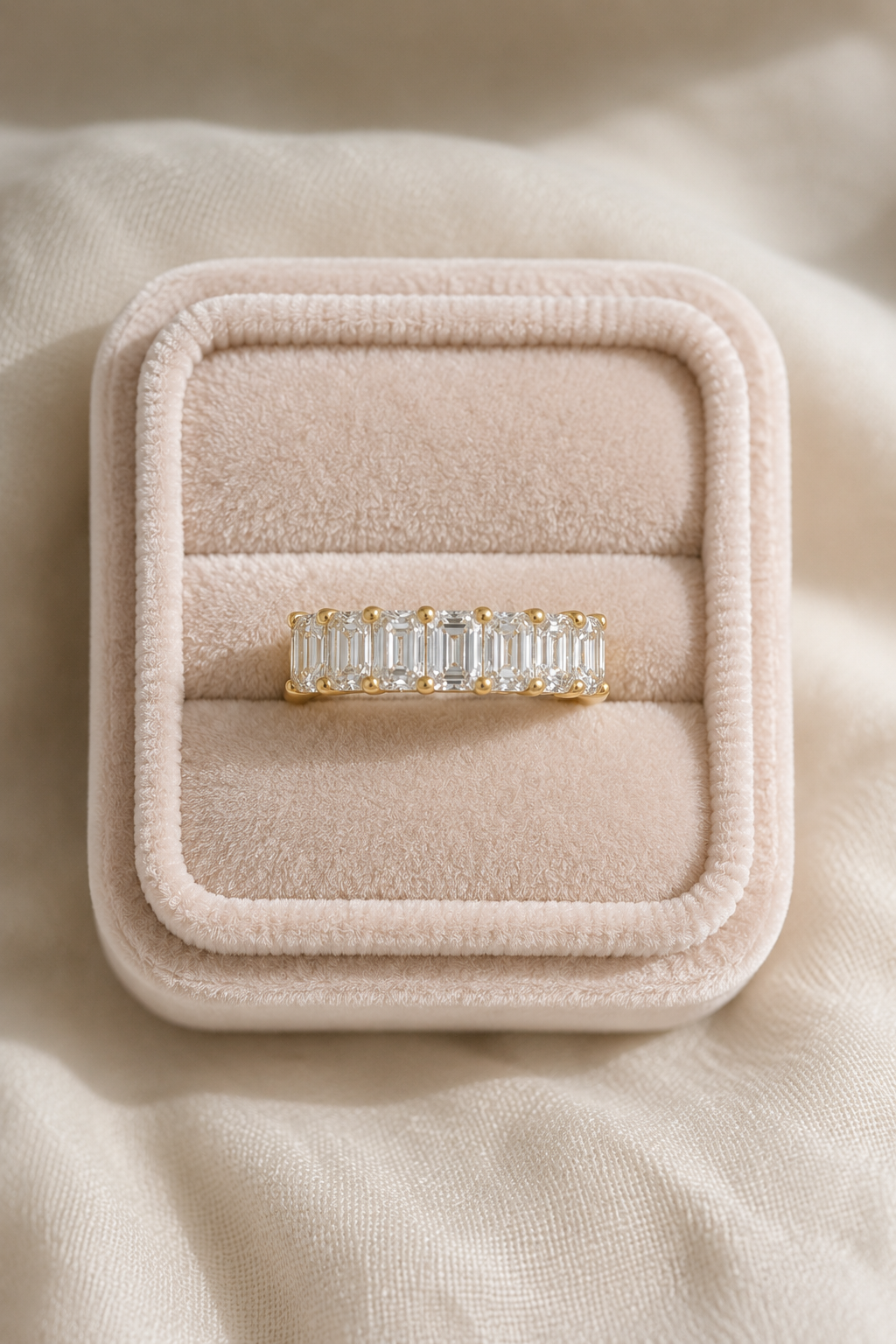 A seven-stone band with lab-grown diamonds set in 14k yellow gold, handcrafted by Brilliant Fine+Custom Jewelry