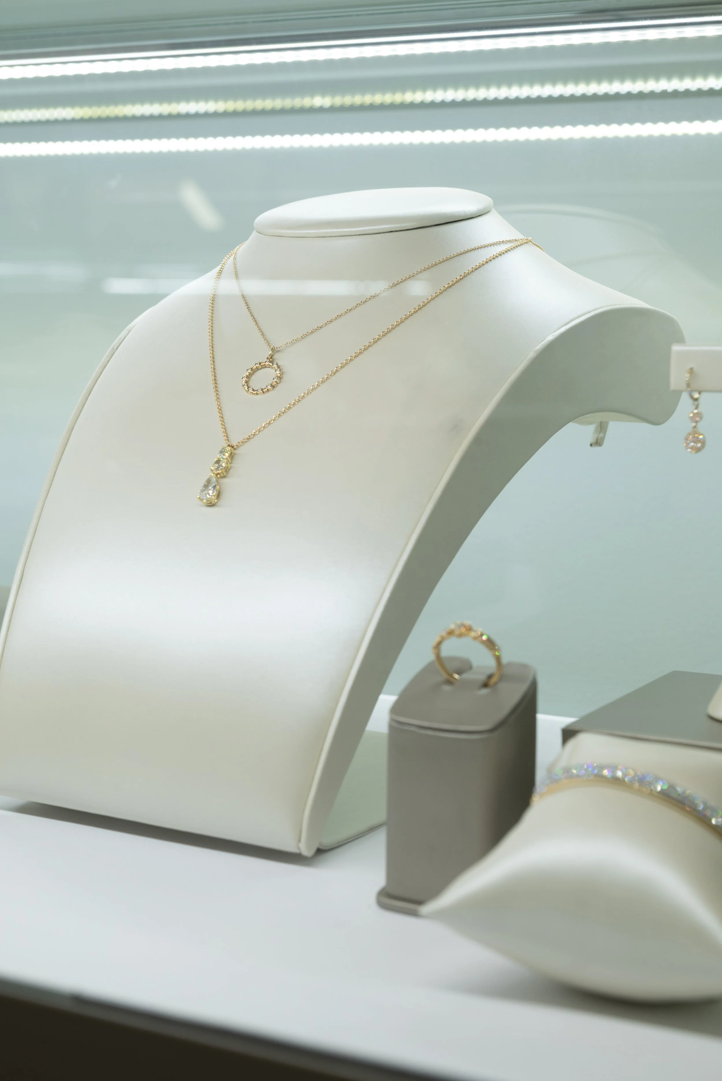 Ready-to-wear fine jewelry gifts including diamond necklaces, earrings, and gemstone rings from Brilliant Fine+Custom Jewelry in Roswell, Georgia.