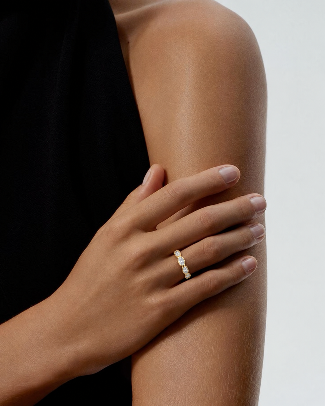 A Diamond band with multiple stones styled in a meaningful ring stack as a push present for a new mom from Brilliant Fine+Custom Jewelry