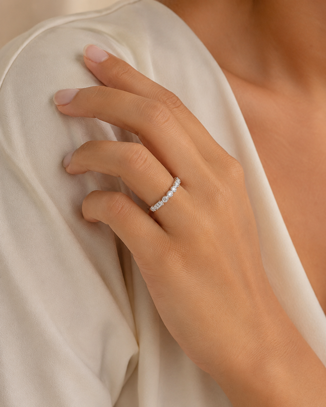 A bezel-set multi-shape diamond half band with milgrain details in white gold from Brilliant Fine+Custom Jewelry.