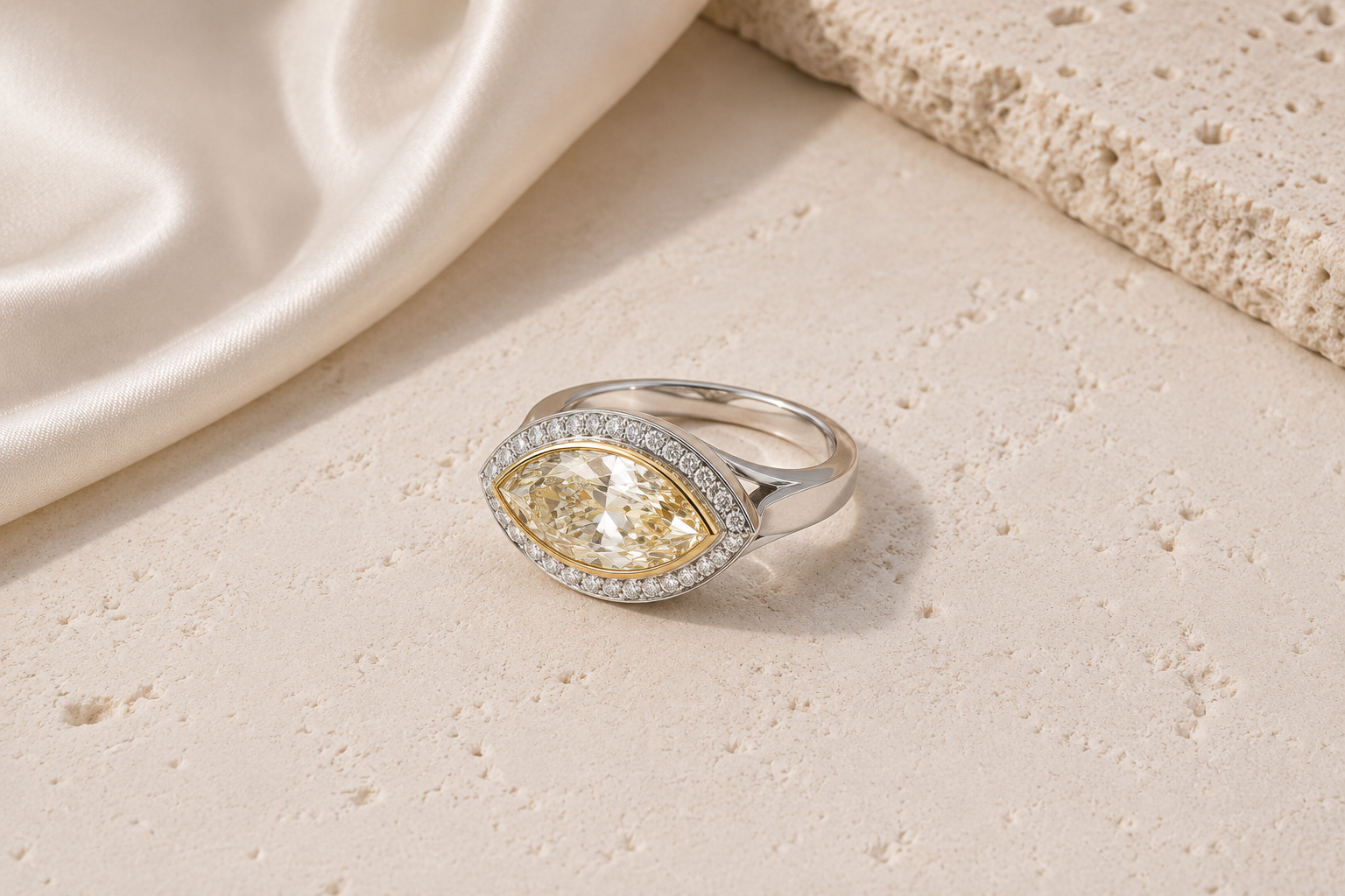 Two-tone gold marquise-cut butter yellow diamond halo ring from Brilliant Fine+Custom Jewelry