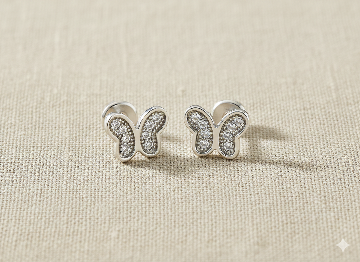 Sterling silver butterfly-shaped stud earrings with cubic zirconia stones made for babies & kids from Brilliant Fine+Custom Jewelry.