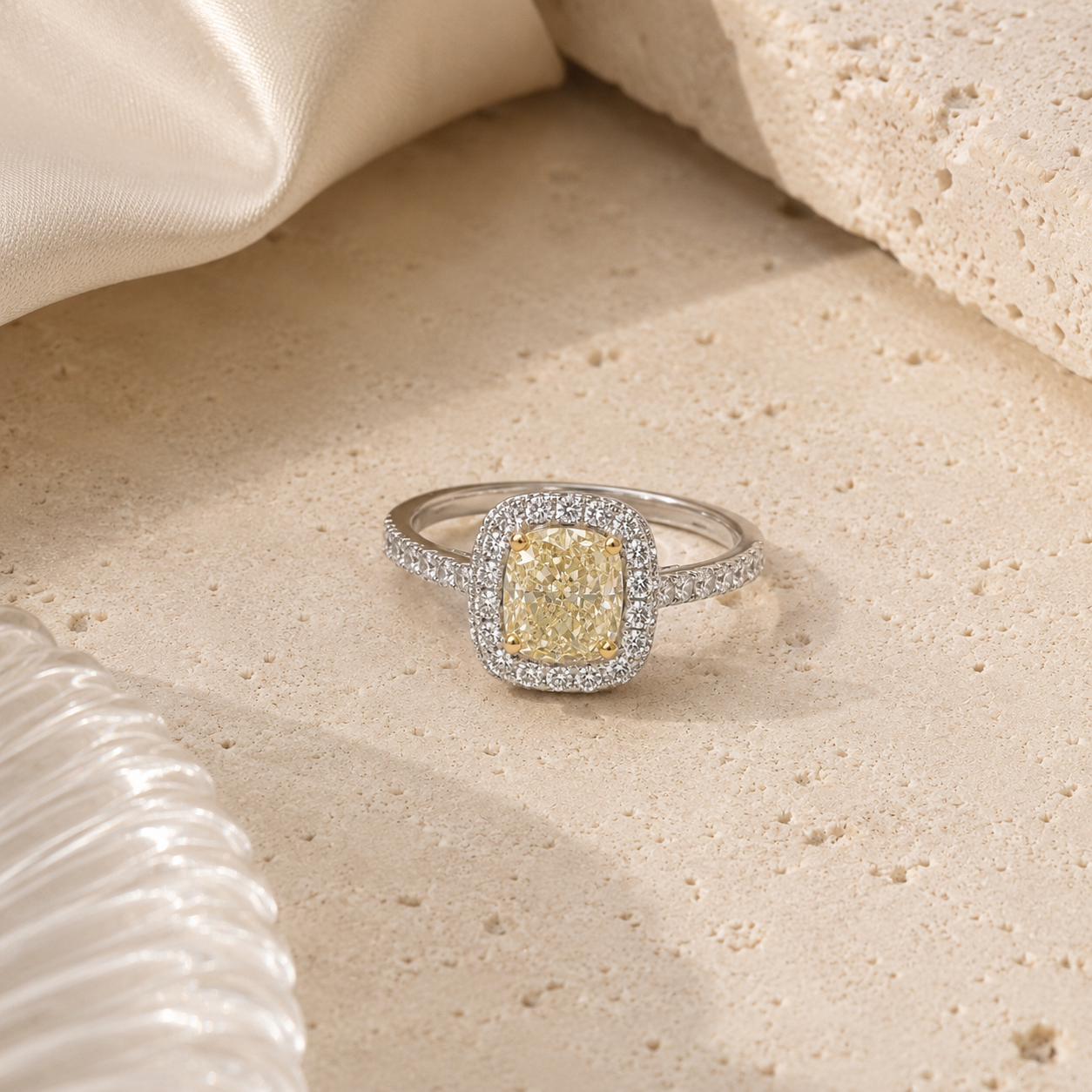 Two-tone gold cushion-cut butter yellow diamond single halo ring from Brilliant Fine+Custom