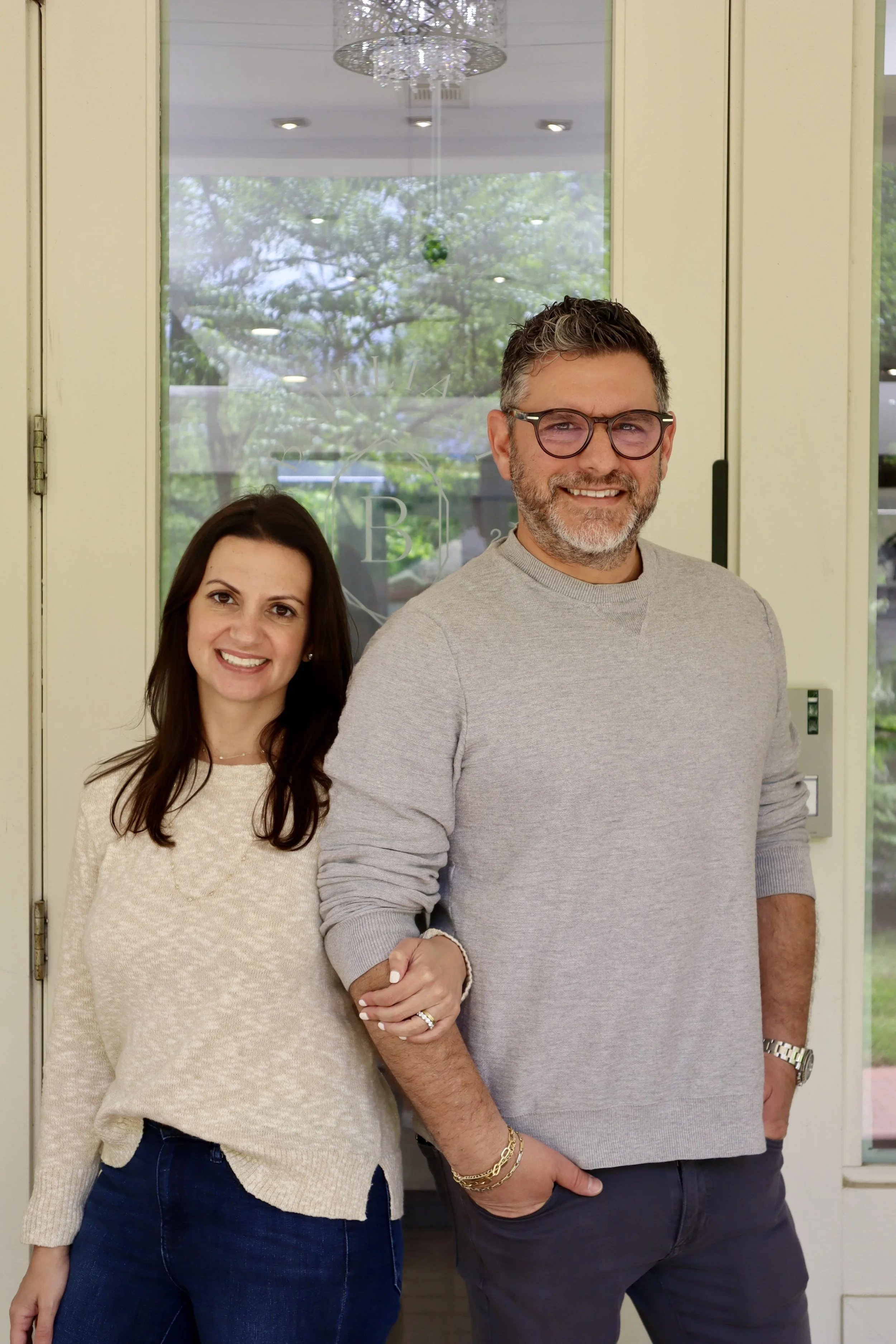 A photo of Katie Jaffe and Jamie Jaffe in front of Brilliant Fine+Custom Jewelry in Roswell Atlanta