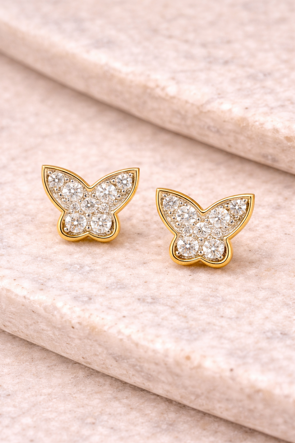 A close up of Diamond Butterfly Stud Earrings from Brilliant Fine+Custom Jewelry