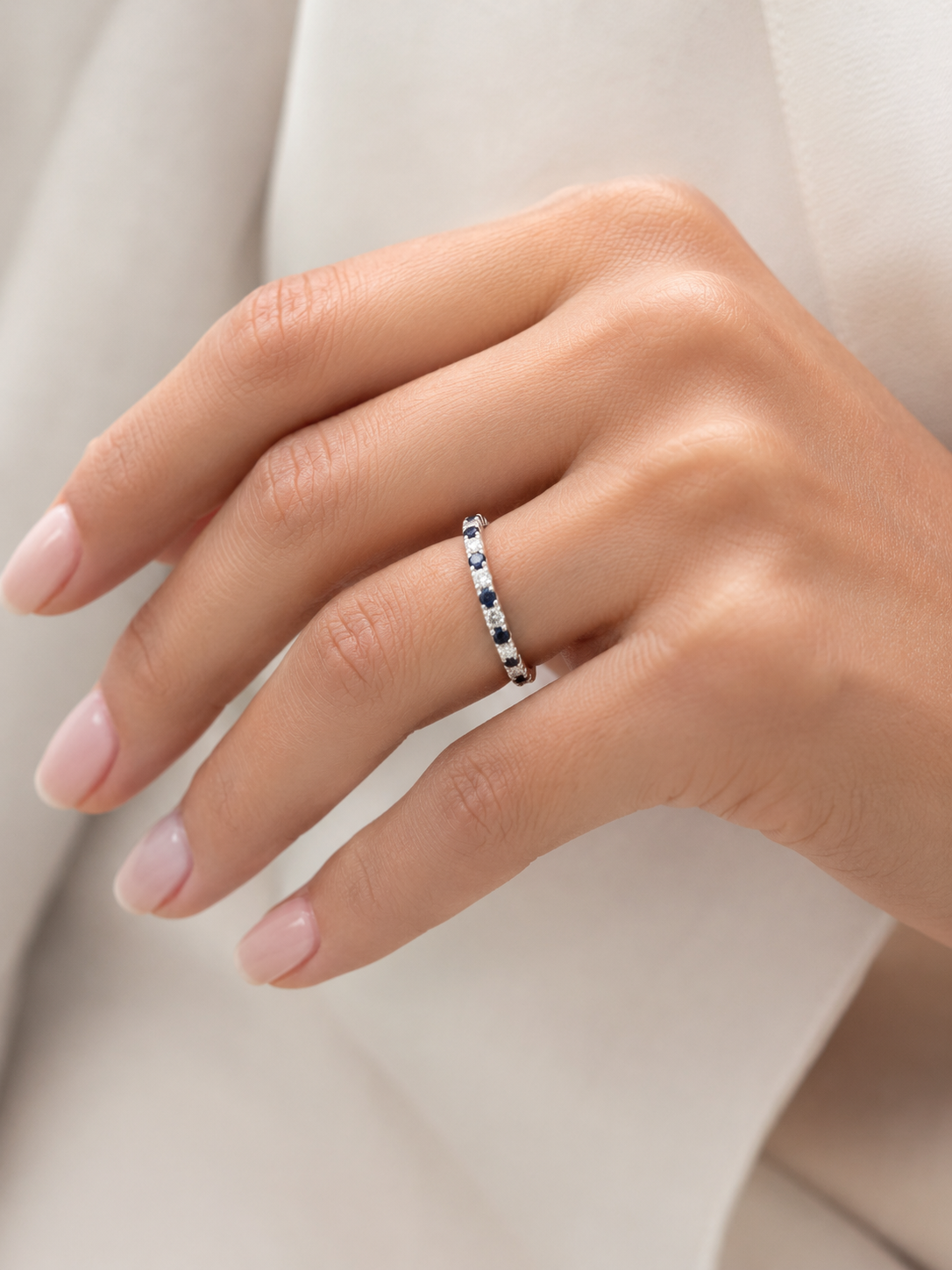 An alternating sapphire and diamond band in white gold from Brilliant Fine+Custom Jewelry, ideal for a personalized ring stack.