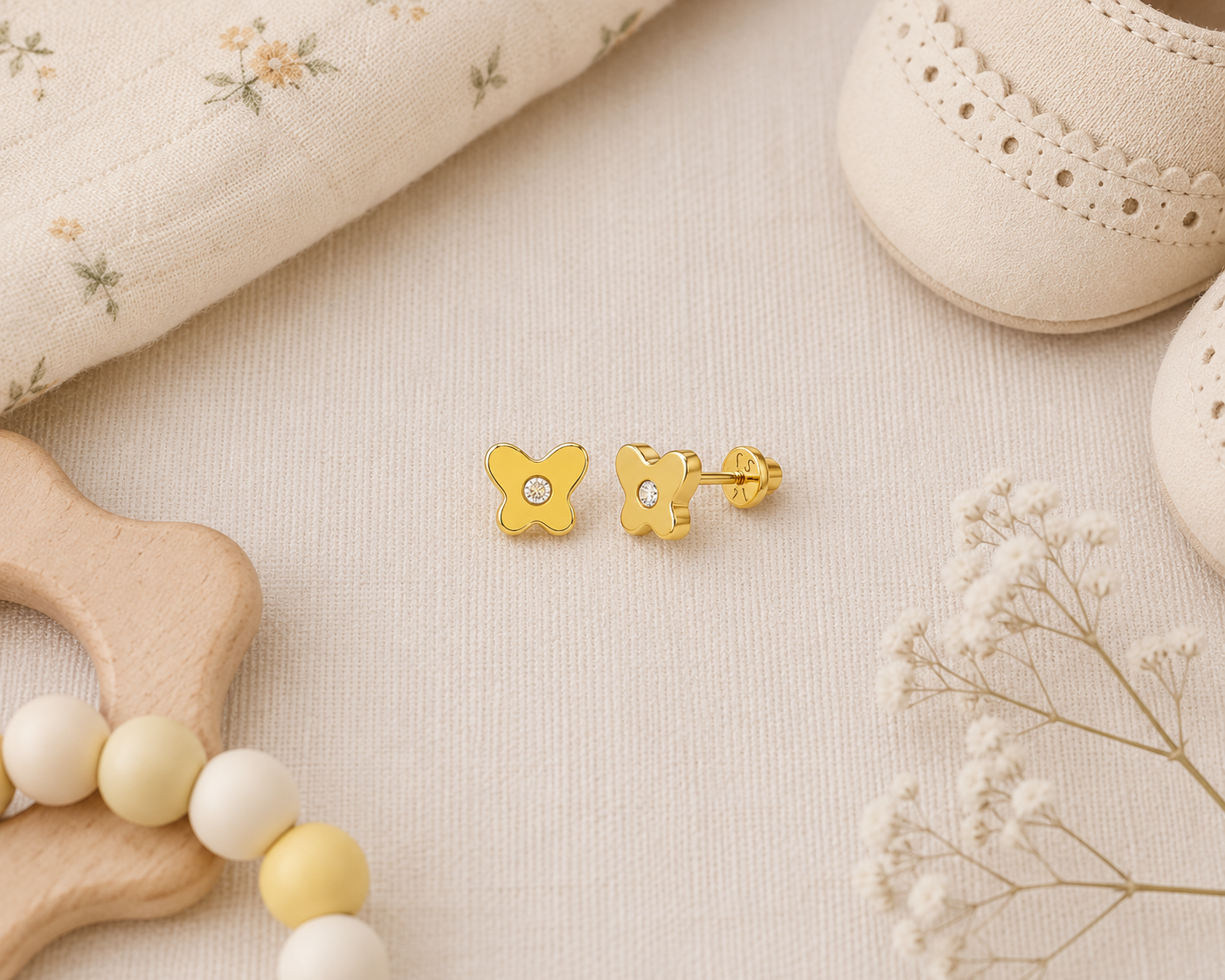 14k yellow gold butterfly-shaped stud earrings with cubic-zirconia stone, made with screw-backs for babies and kids from Brilliant Fine+Custom Jewelry