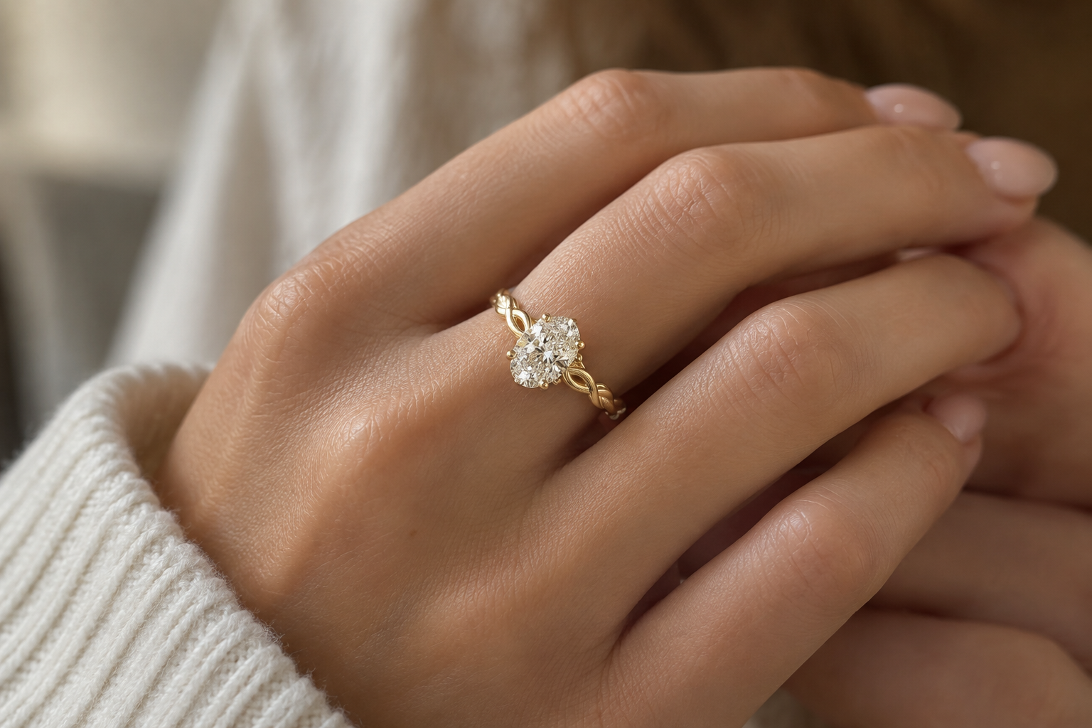 Custom oval-cut diamond engagement ring in 14k yellow gold from Brilliant Fine+Custom jewelry.