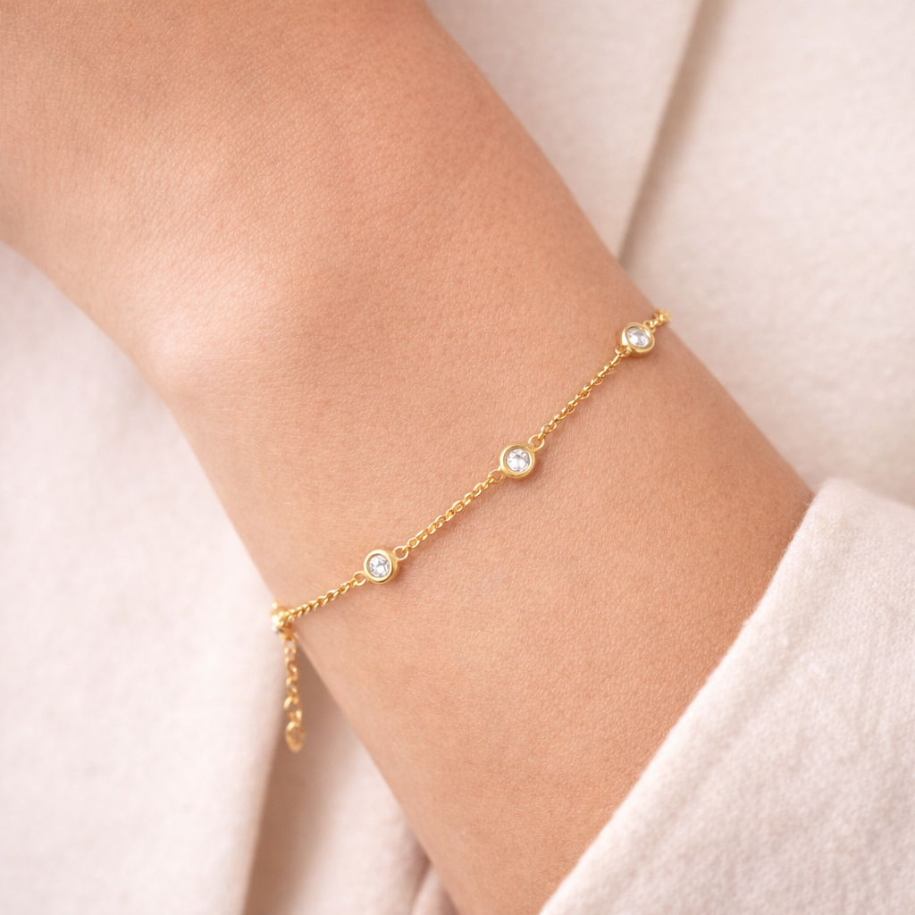 A close up of our Diamond Station Bracelet in 14k yellow gold from Brilliant Fine+Custom Jewelry.