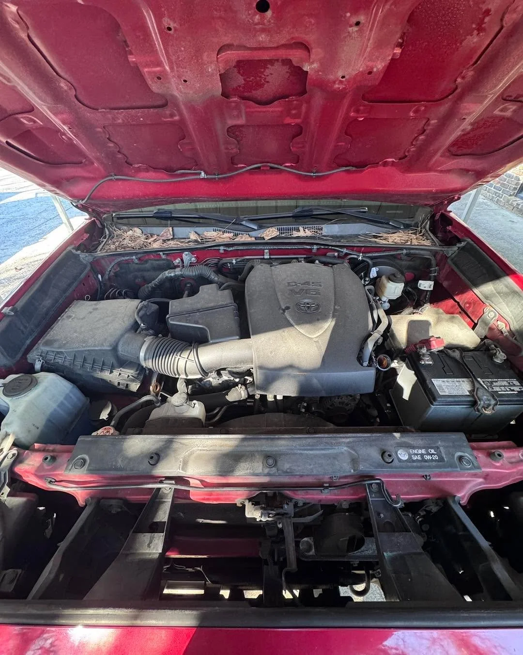Before: dust, grease, and road grime built up under the hood.
After: a clean, fresh engine bay that actually looks maintained.

Most people focus on the paint and interior, but a properly detailed vehicle means clean everywhere &mdash; even under the
