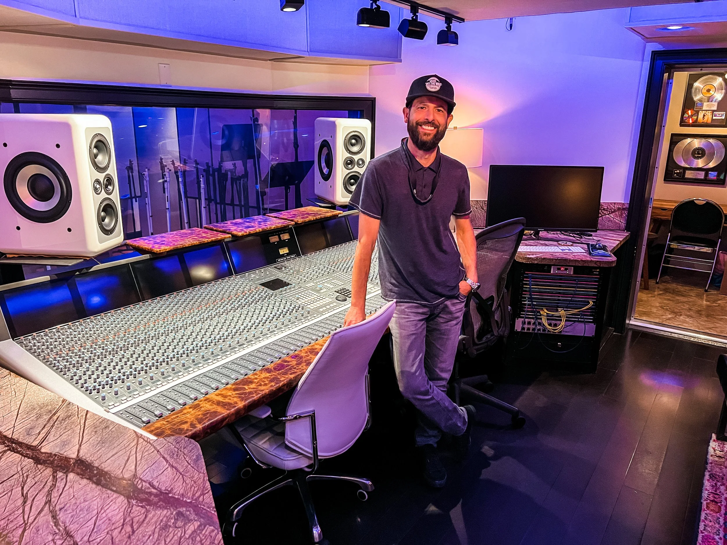 Vincent DiPasquale at Vanquish Studios checking out our custom white Barefoot Sound MM26 Monitors. Vincent DiPasquale was the main consultant to Joseph Salamida, the owner and founder of Vanquish Studios, during the original design and build in 2007.