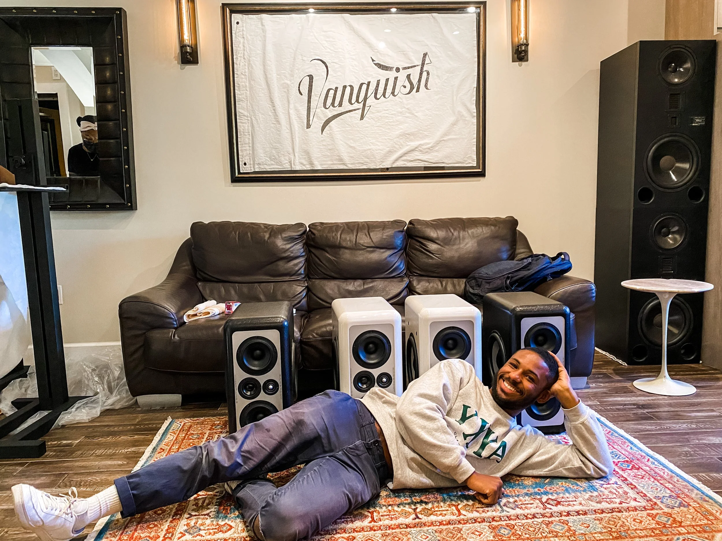 Luke Alexander lounging in front of Barefoot Sound MM26's Monitors. Also shown in this photo is the Vanquish Studios custom Wild Standard Flag and the studios Adam S5VA's Loudspeakers. 