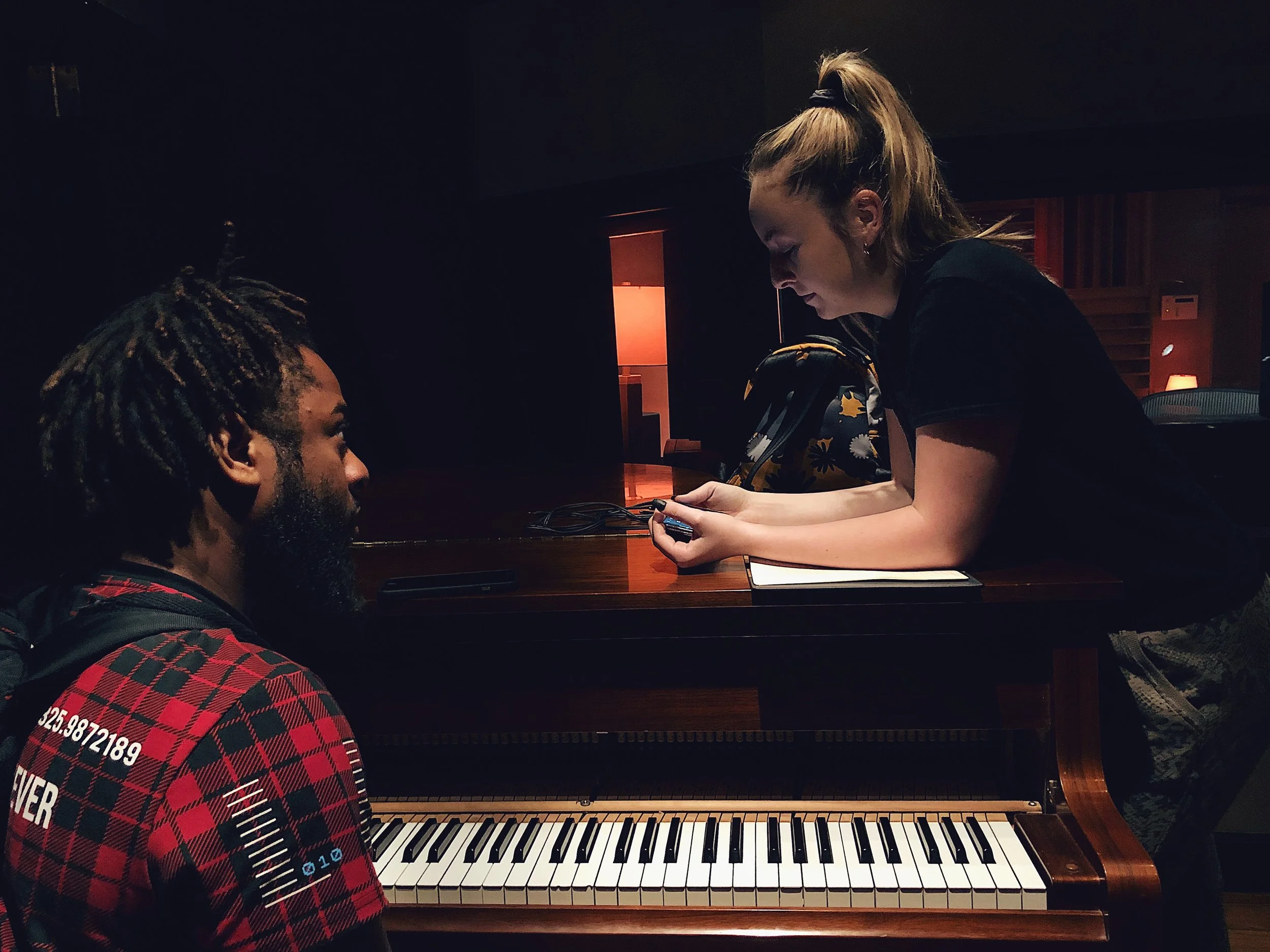 Producer Terrence "Tracksion" Rolle working with an artist on her original music at Vanquish Studios. 